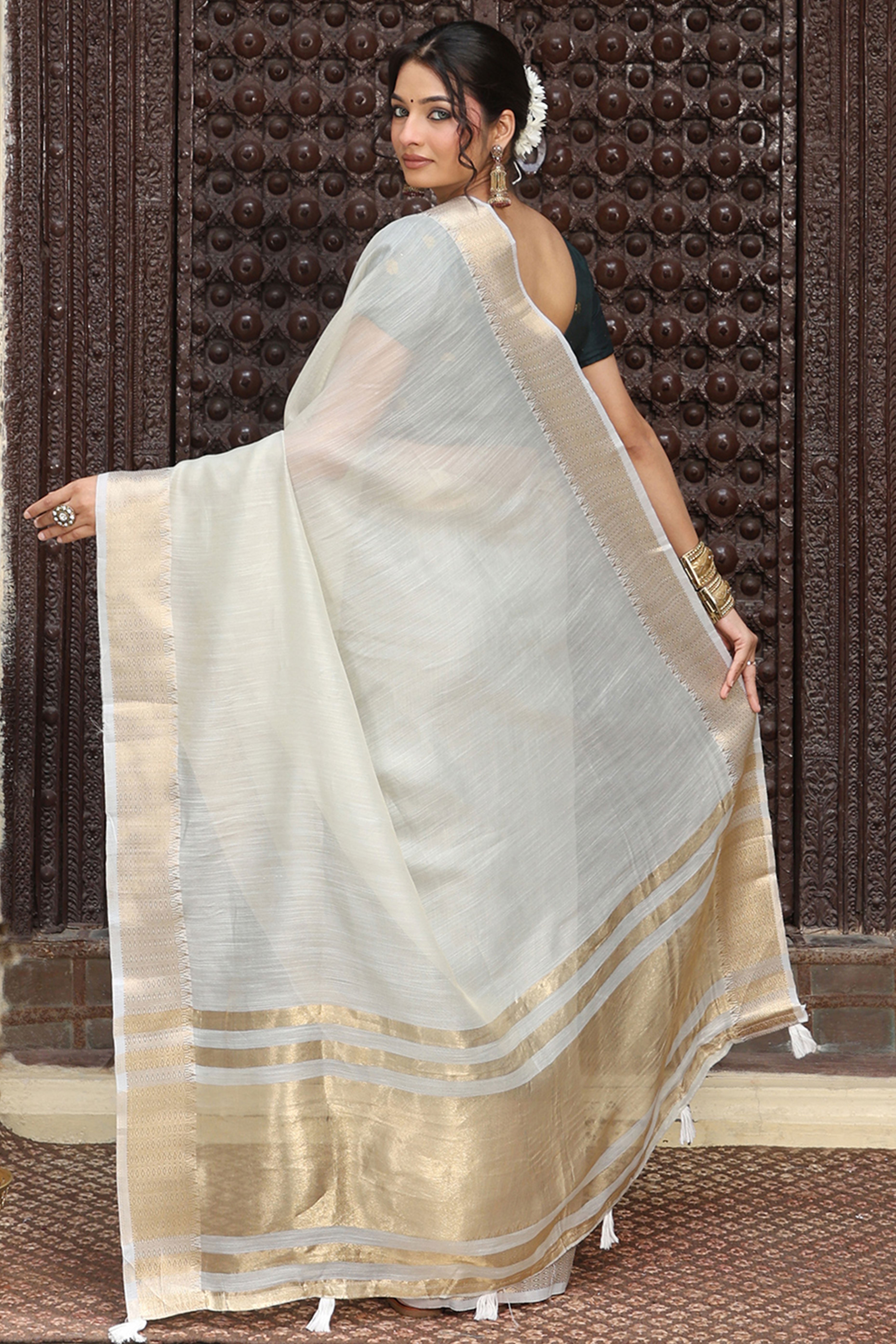 Charming Grey Zari Weaving Cotton Blend Saree Adorned With Stylish Tassel Detailing