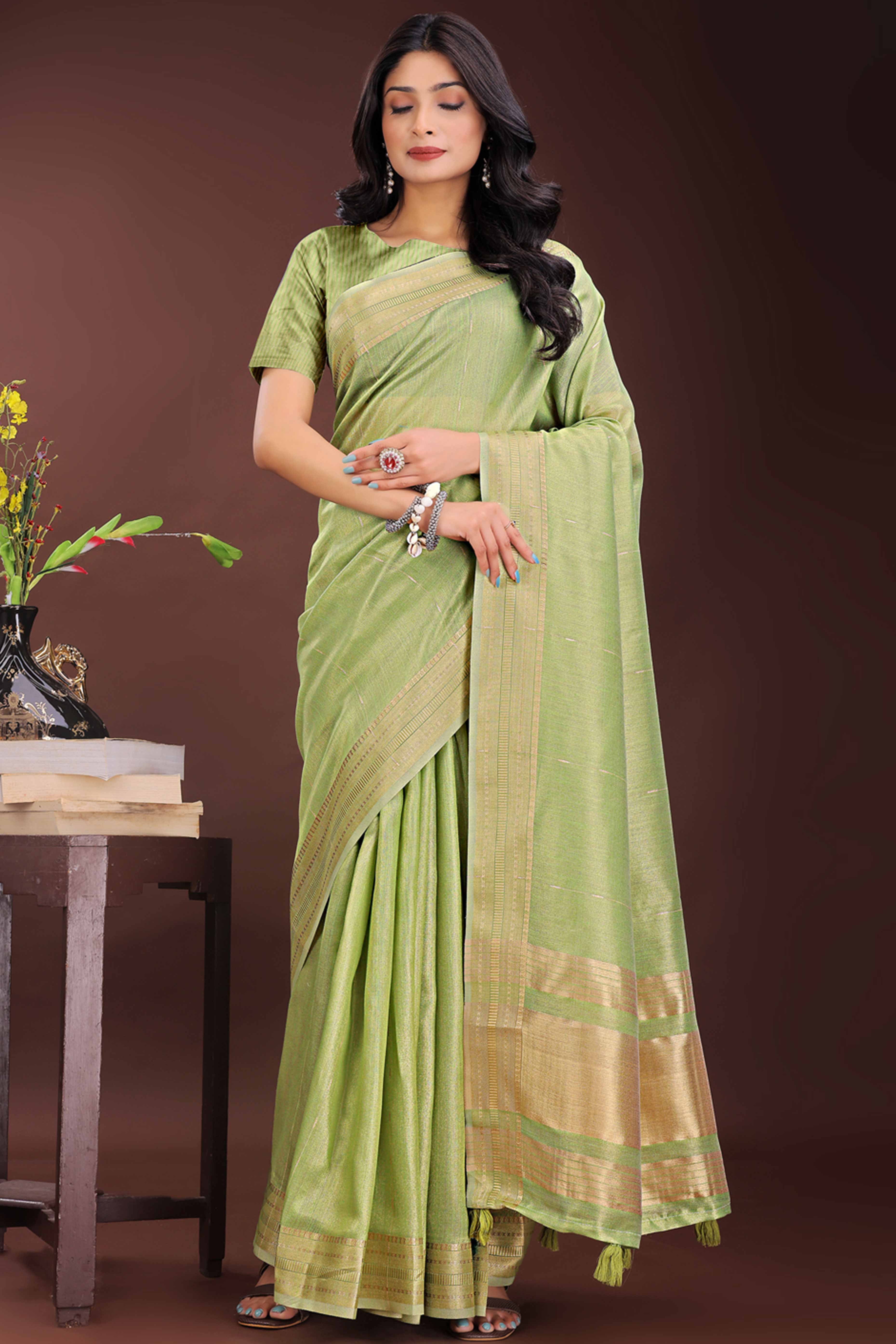 Green Organza Saree Adorned With Zari Weave & Tassel Edges