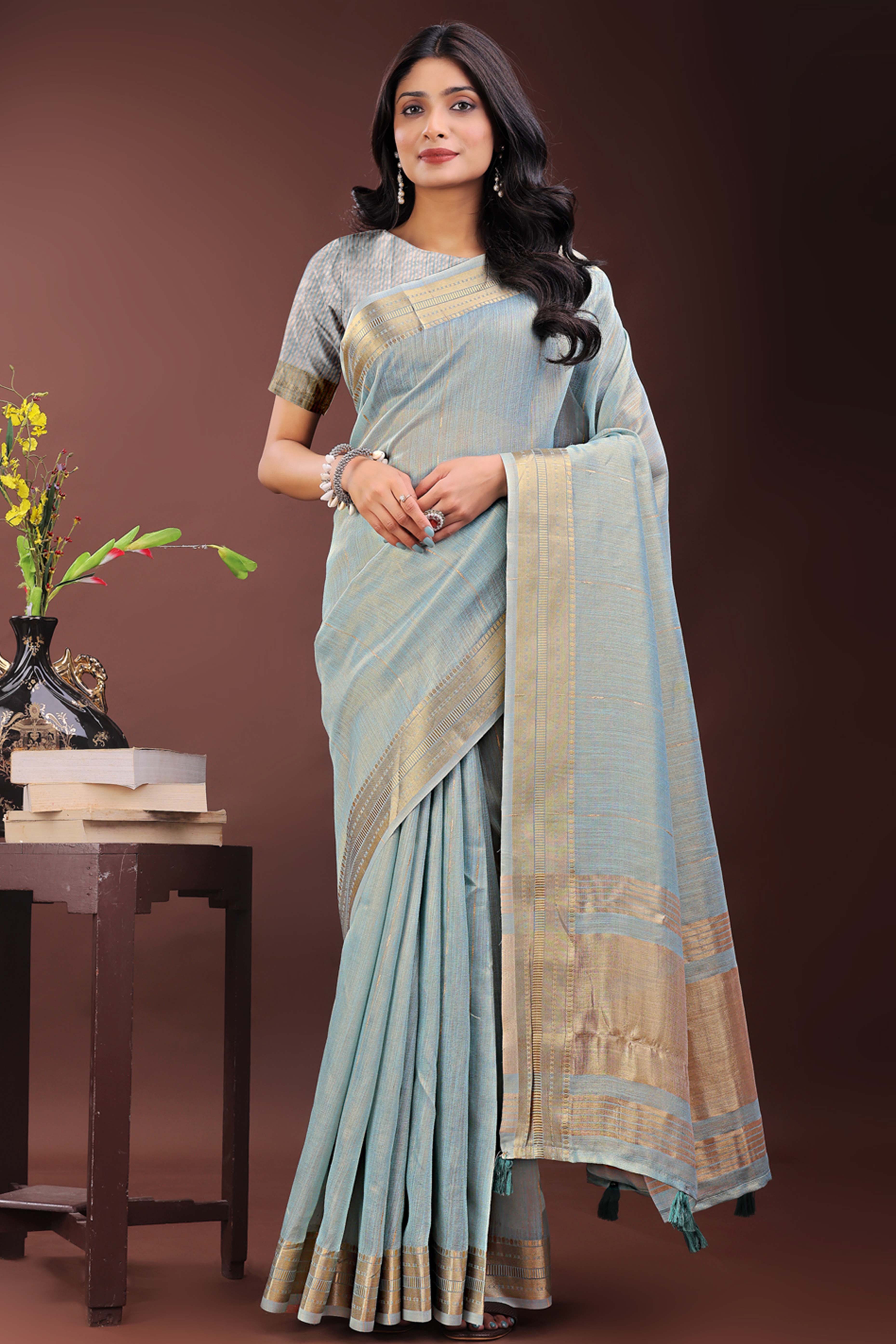 Greyish Blue Organza Saree Adorned With Zari Weave & Tassel Edges