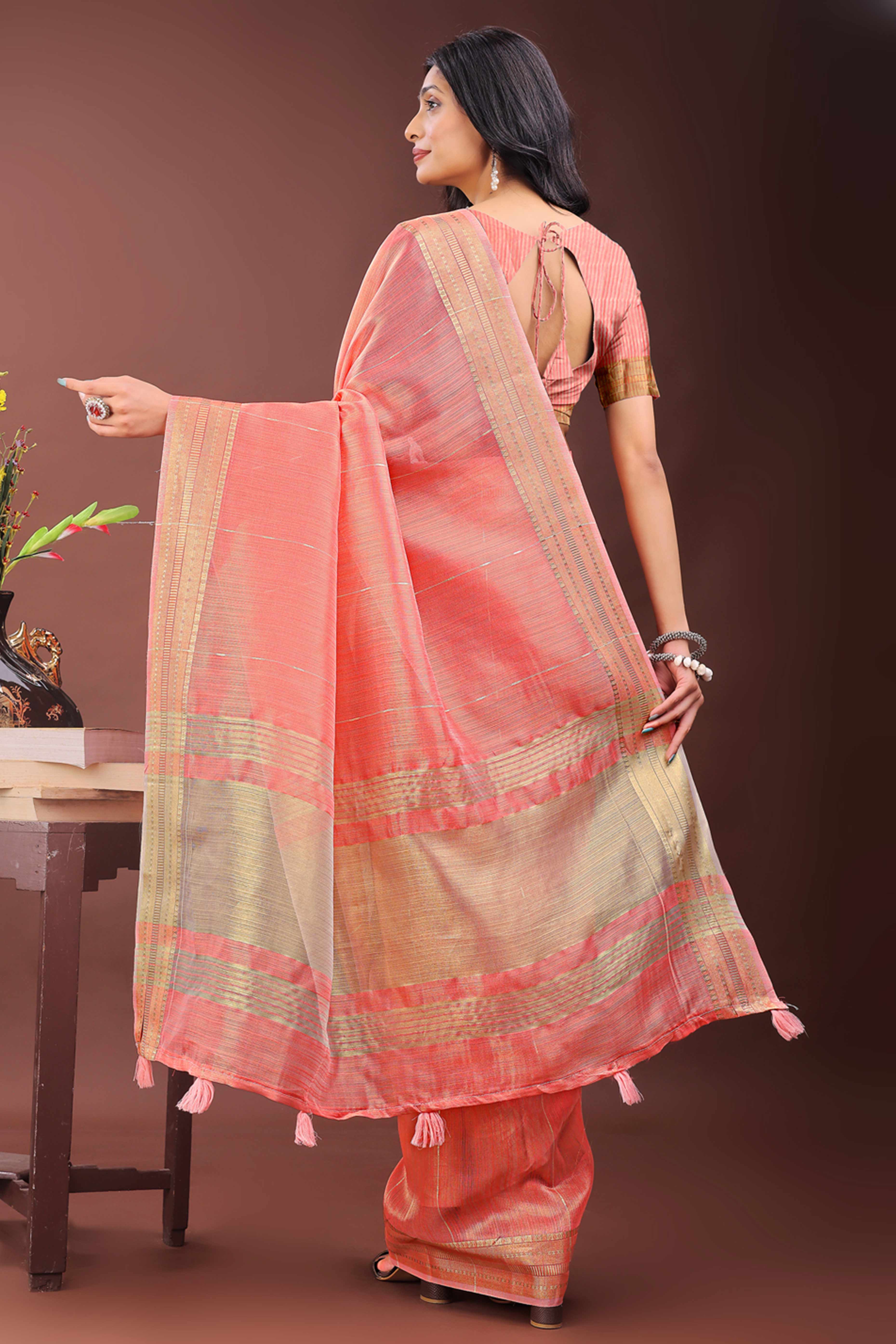 Coral Pink Organza Saree Adorned With Zari Weave & Tassel Edges