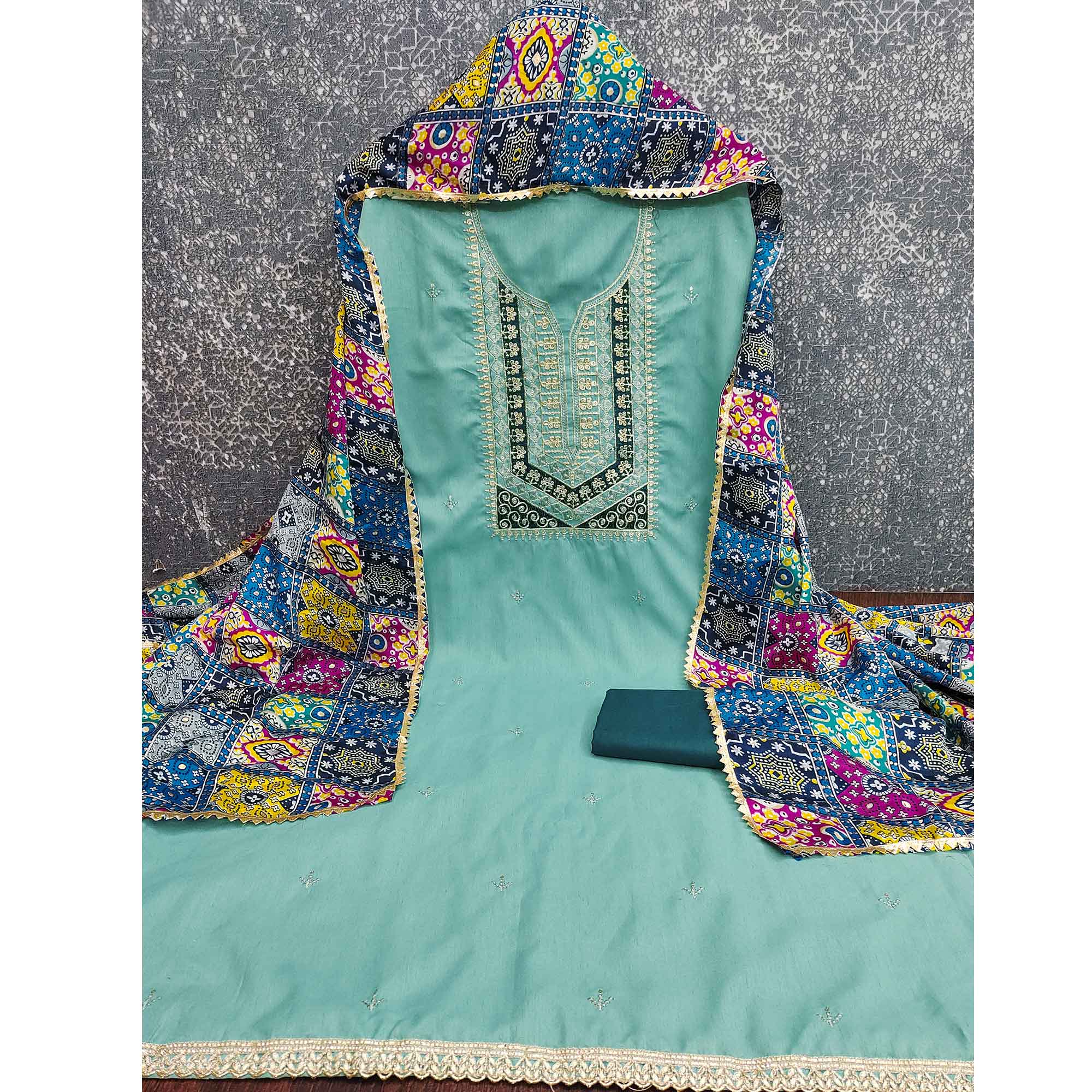 Stylish Turquoise Cotton Blend Dress Material Enriched With Floral Embroidery & Sequins Work