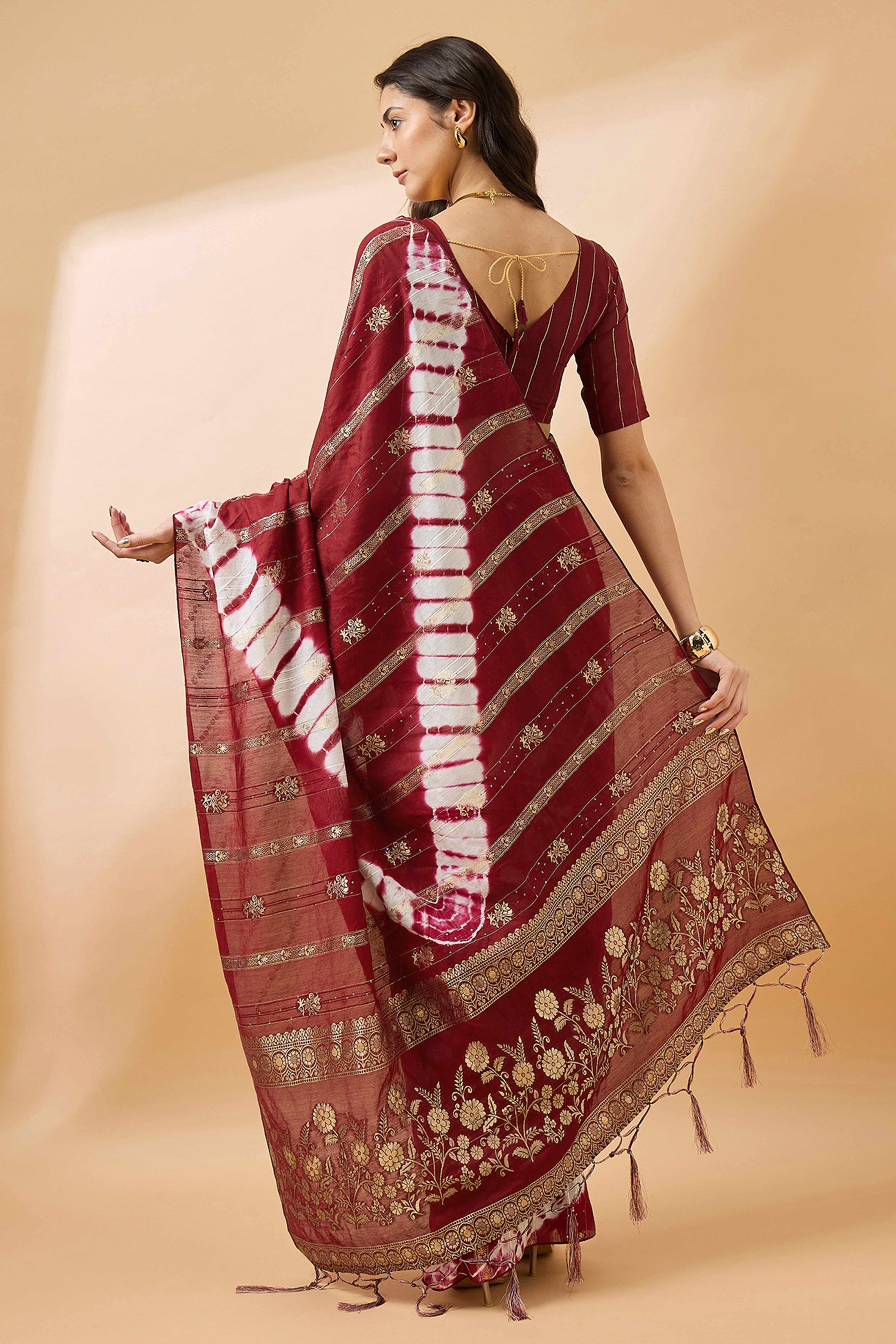 Maroon Floral Woven Staple Cotton Blend Saree Highlighted With Sequins Embroidery & Tasselled Pallu