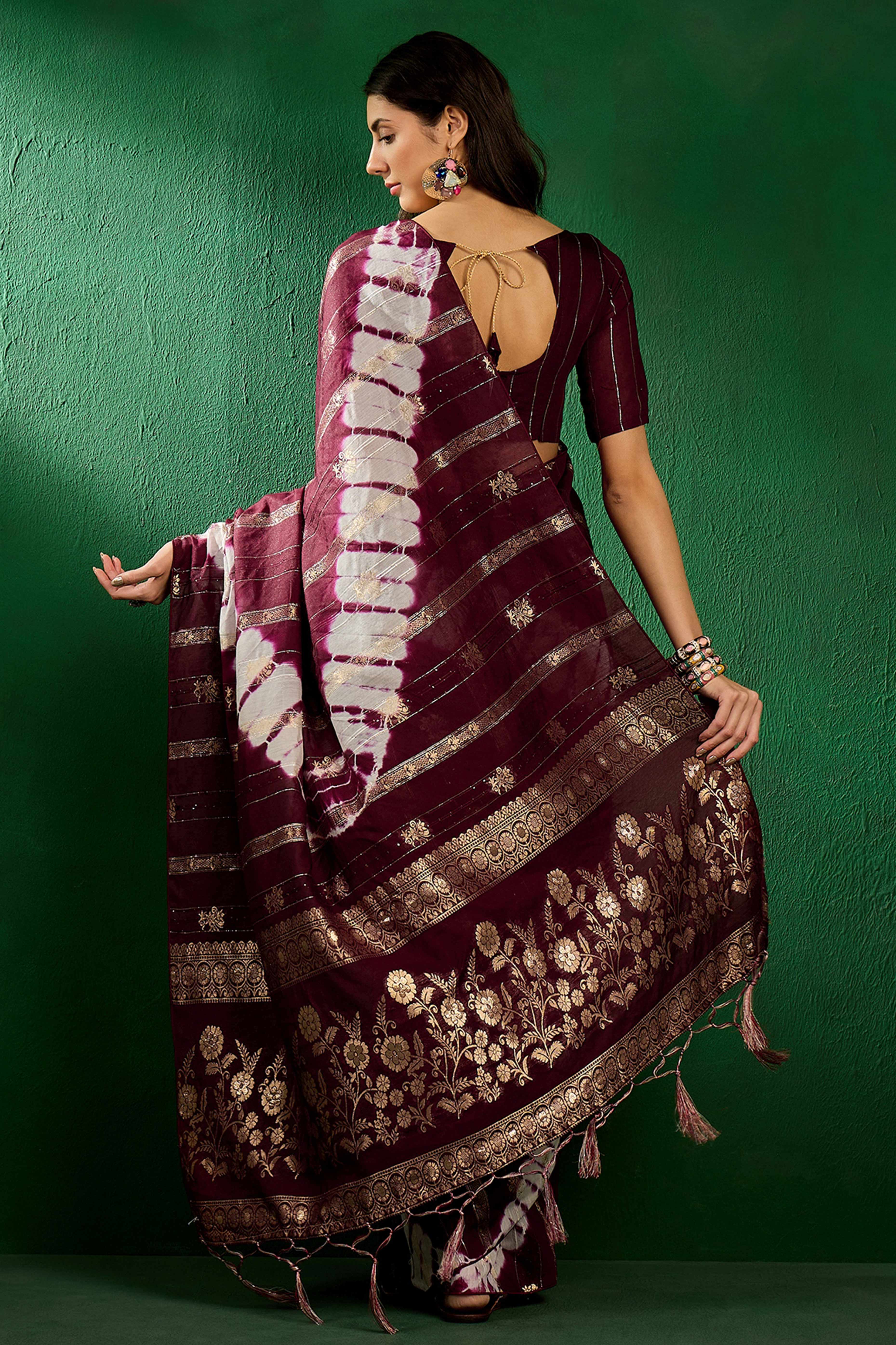 Wine Floral Woven Staple Cotton Blend Saree Highlighted With Sequins Embroidery & Tasselled Pallu
