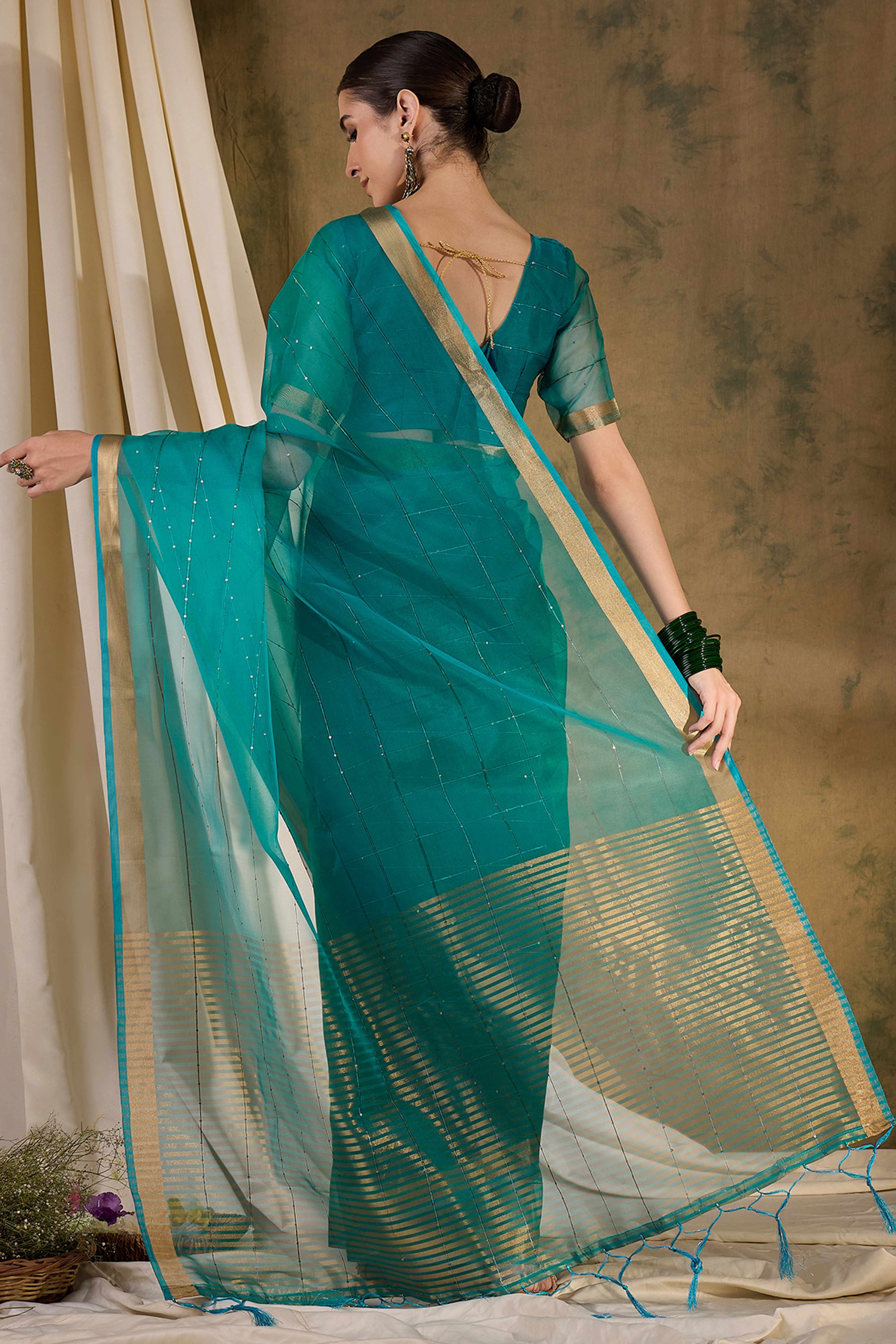 Teal Organza Silk Saree Featuring Shimmering Sequins Embroidery & Elegant Tasselled Pallu