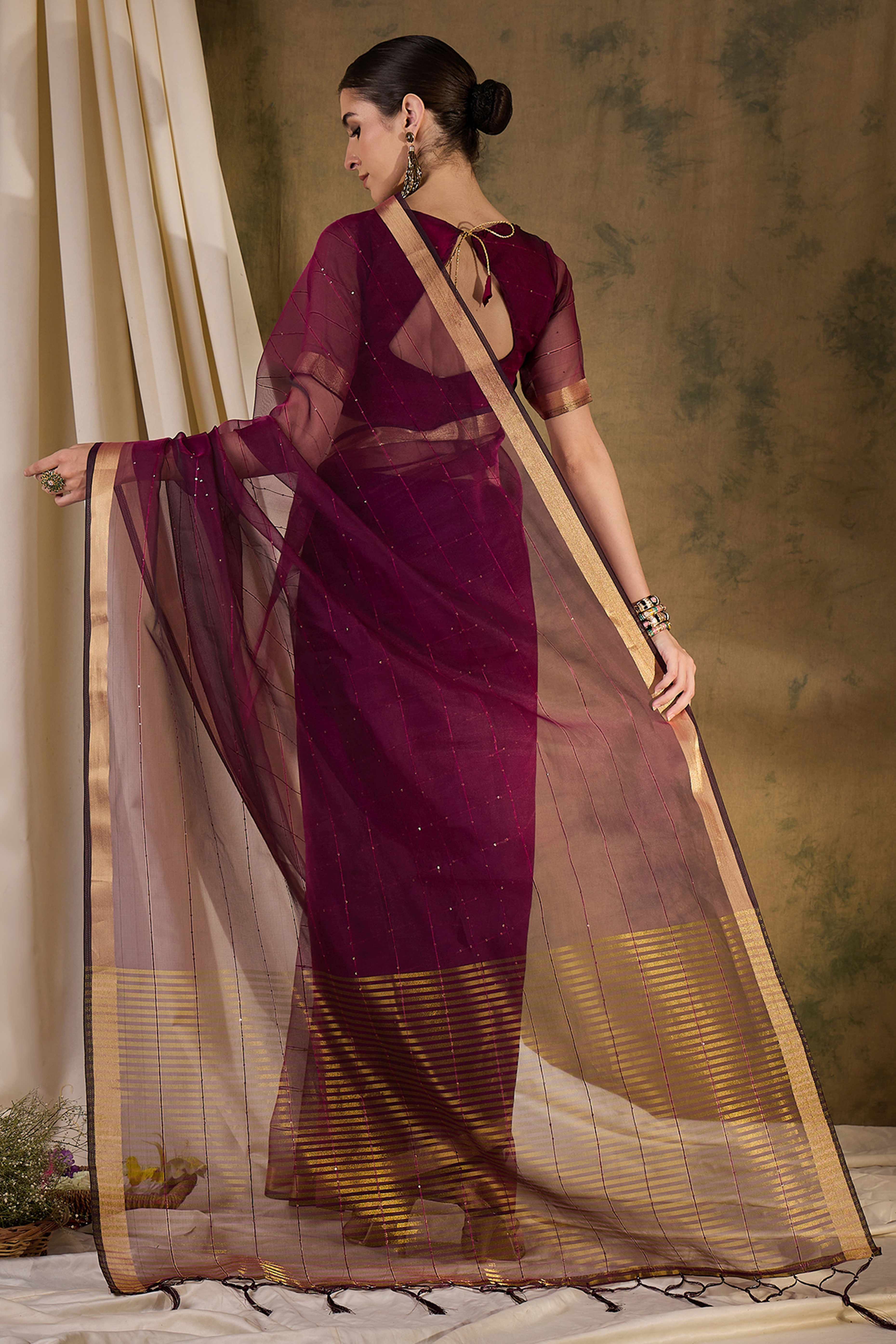 Wine Organza Silk Saree Featuring Shimmering Sequins Embroidery & Elegant Tasselled Pallu