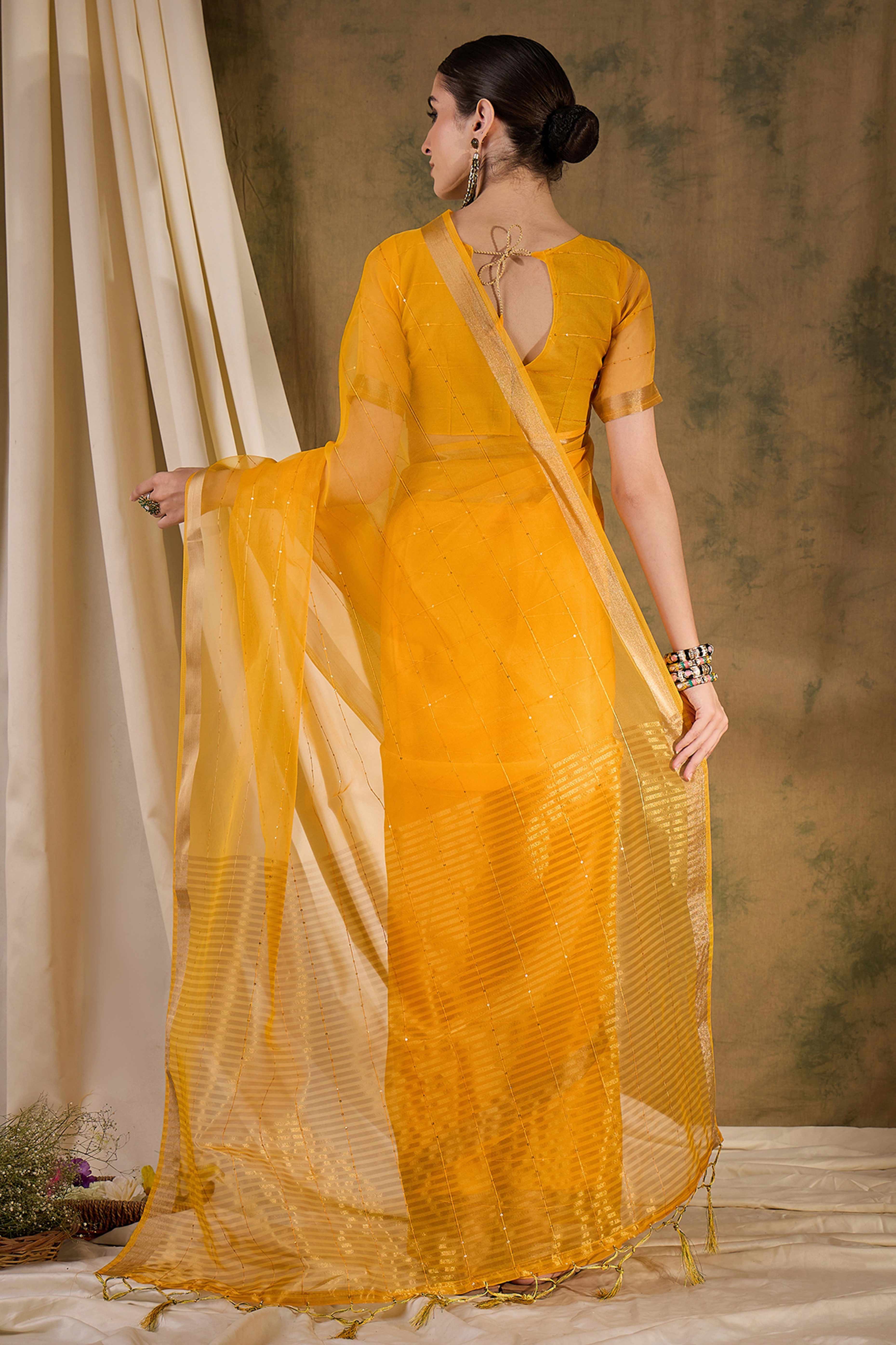Yellow Organza Silk Saree Featuring Shimmering Sequins Embroidery & Elegant Tasselled Pallu