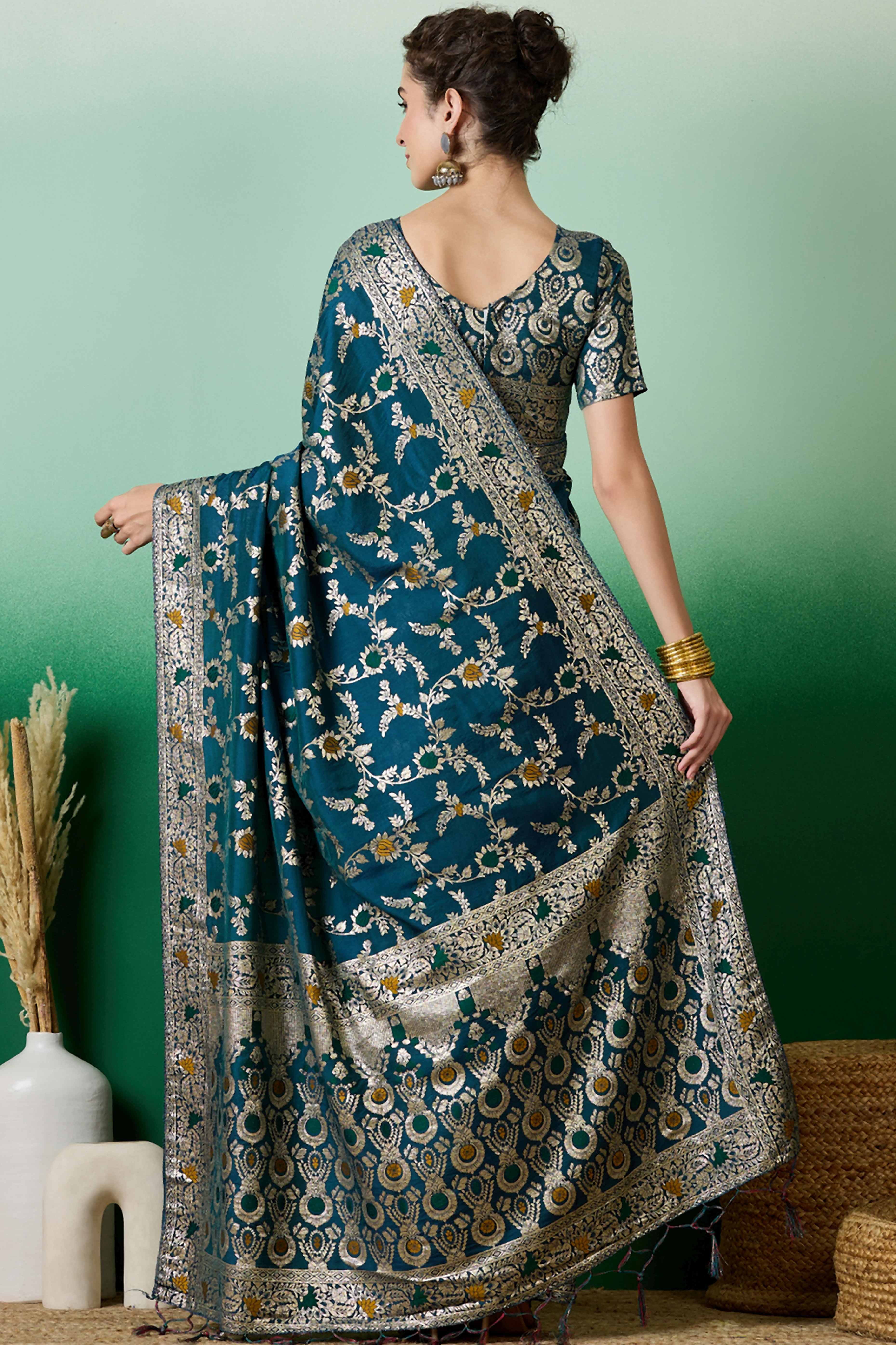 Teal Cotton Meena jacquard Saree Featuring Intricate Floral Weaving & Tassels On The Pallu