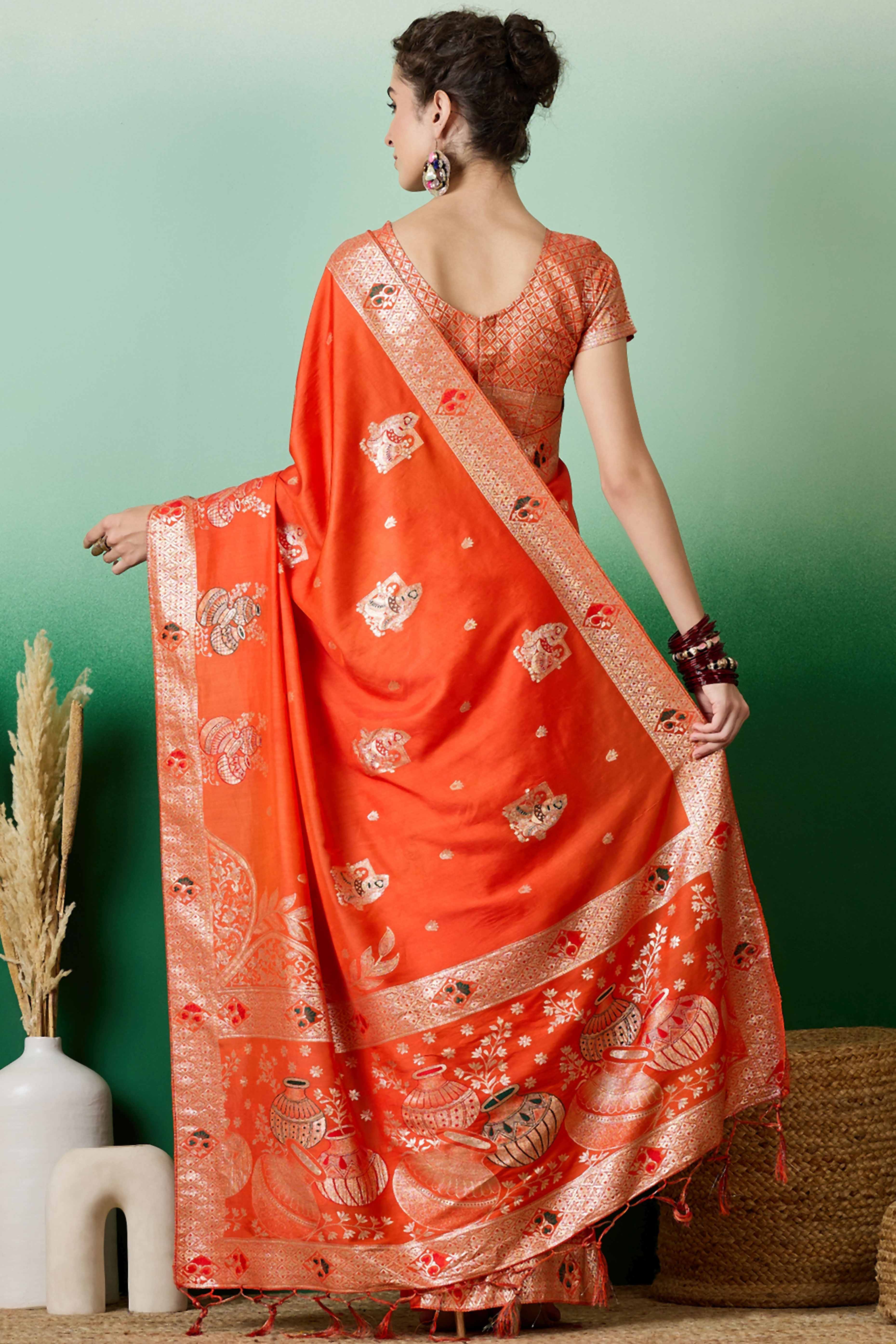 Orange Cotton Blend Saree Adorned With Floral Zari Weaving & Soft Tassel Accents
