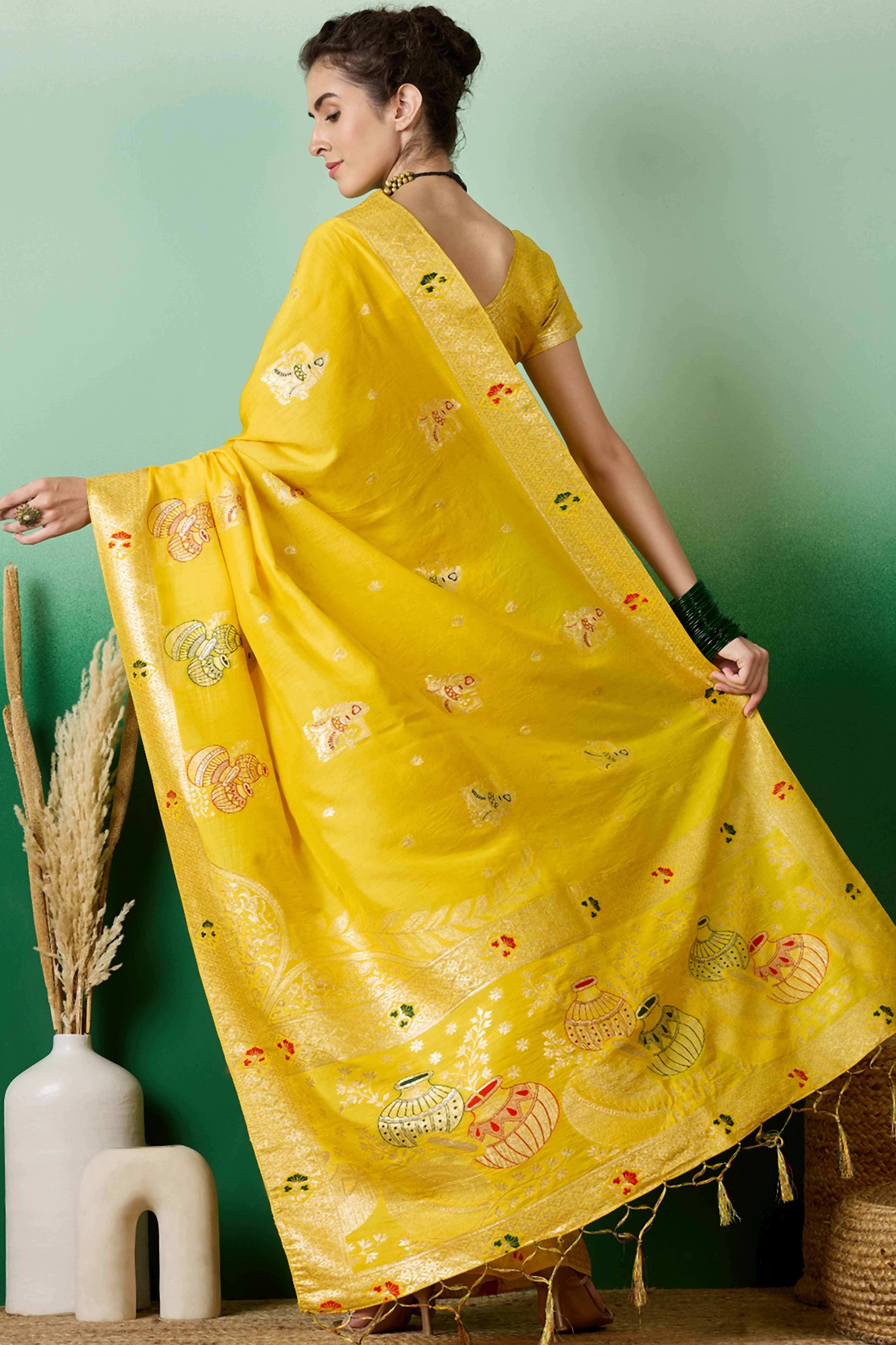 Yellow Cotton Blend Saree Adorned With Floral Zari Weaving & Soft Tassel Accents