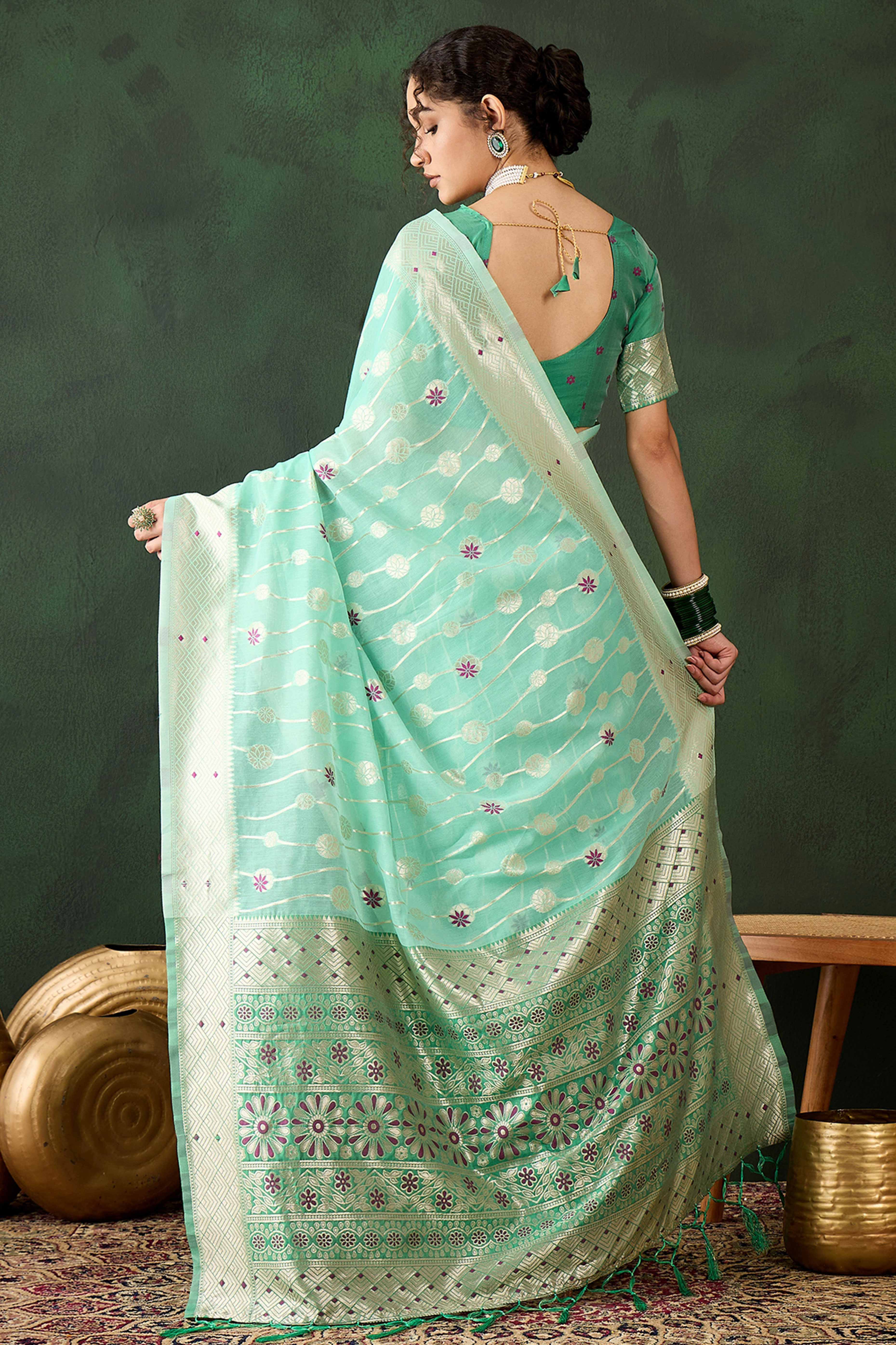 Sea Green Cotton Blend Saree Adorned With Intricate Floral Zari Weaving & A Stylish Tassel Pallu