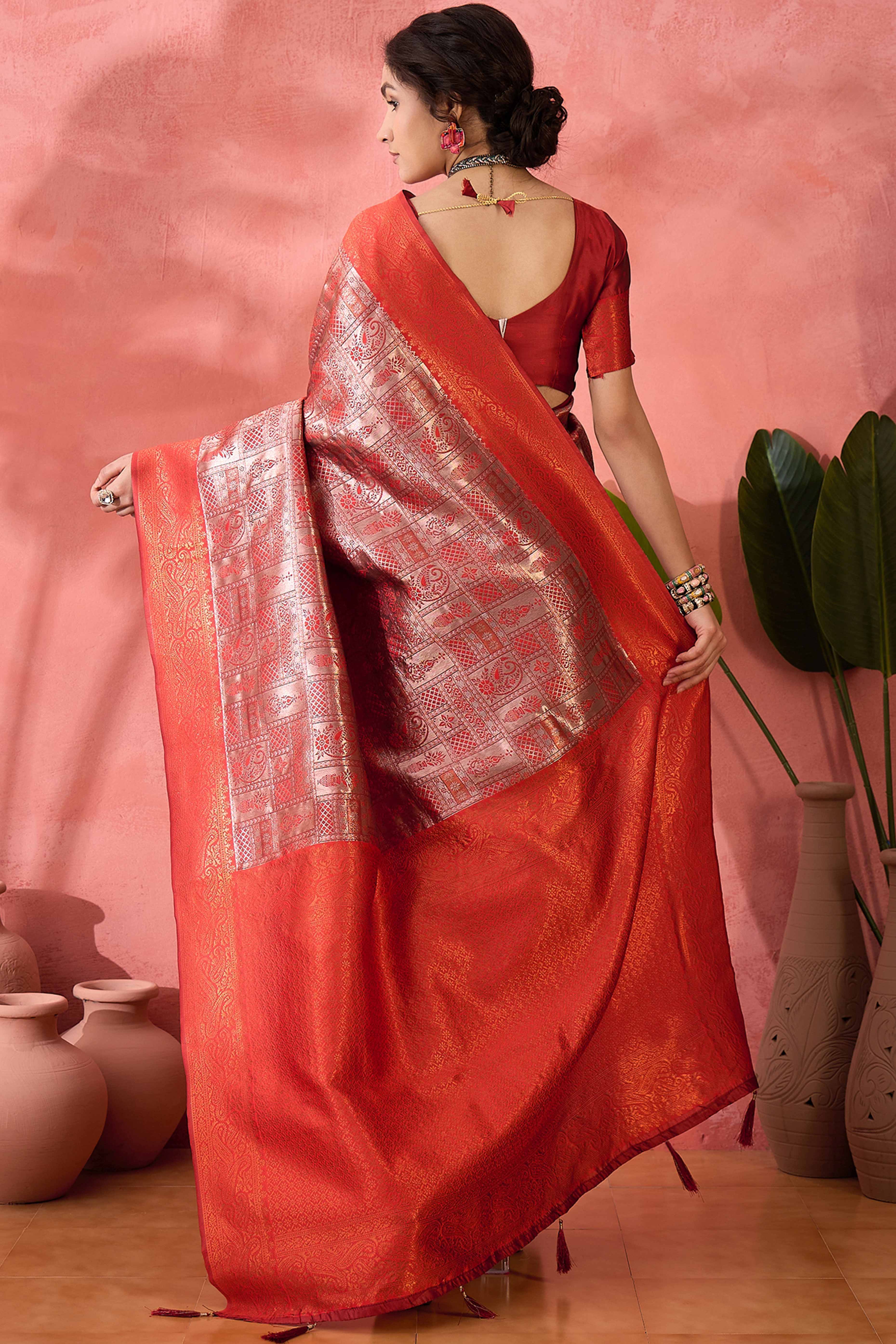 Rust Woven Poly Silk Blend Saree Featuring Floral & Paisley Motifs With Tassel Accents