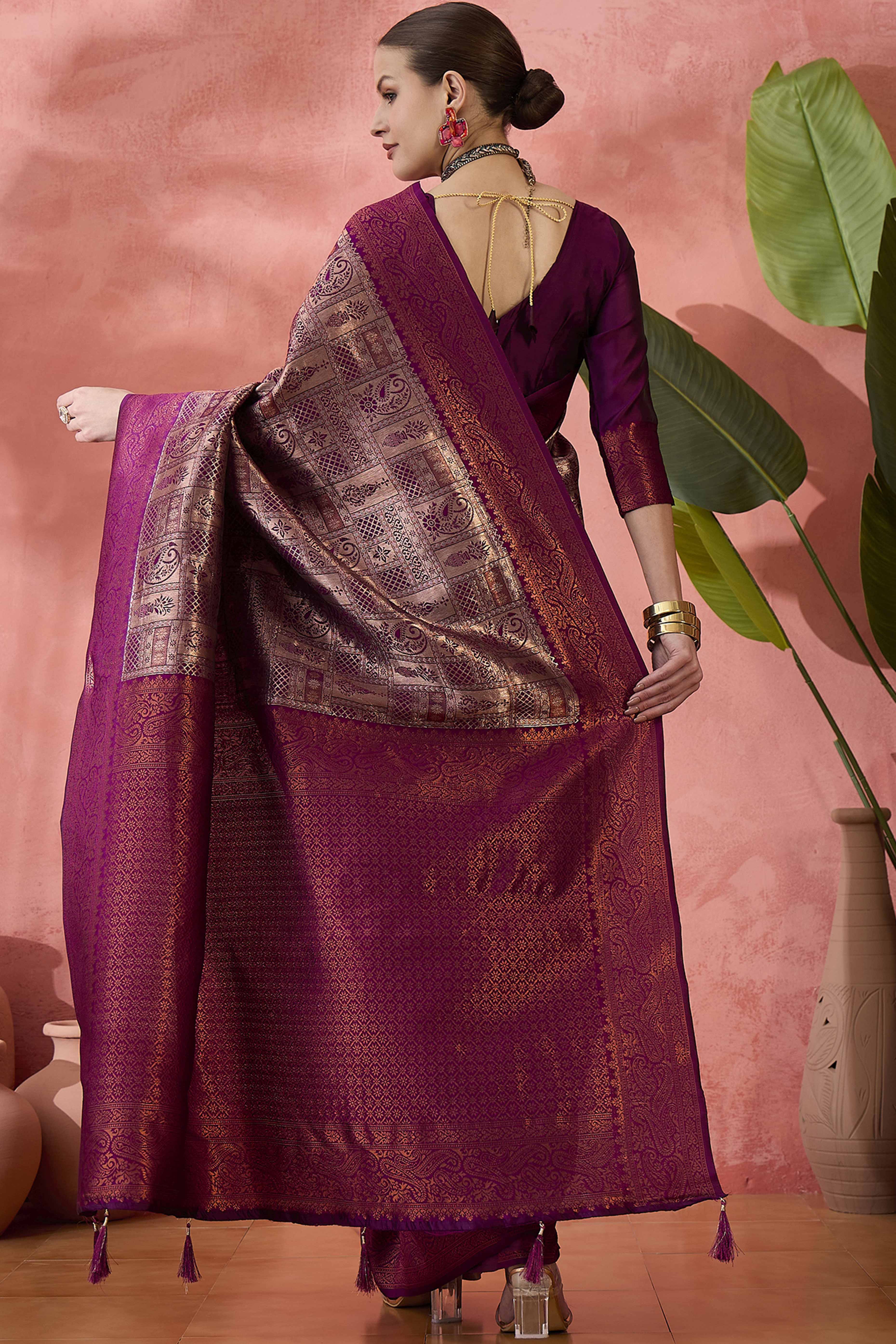Wine Woven Poly Silk Blend Saree Featuring Floral & Paisley Motifs With Tassel Accents