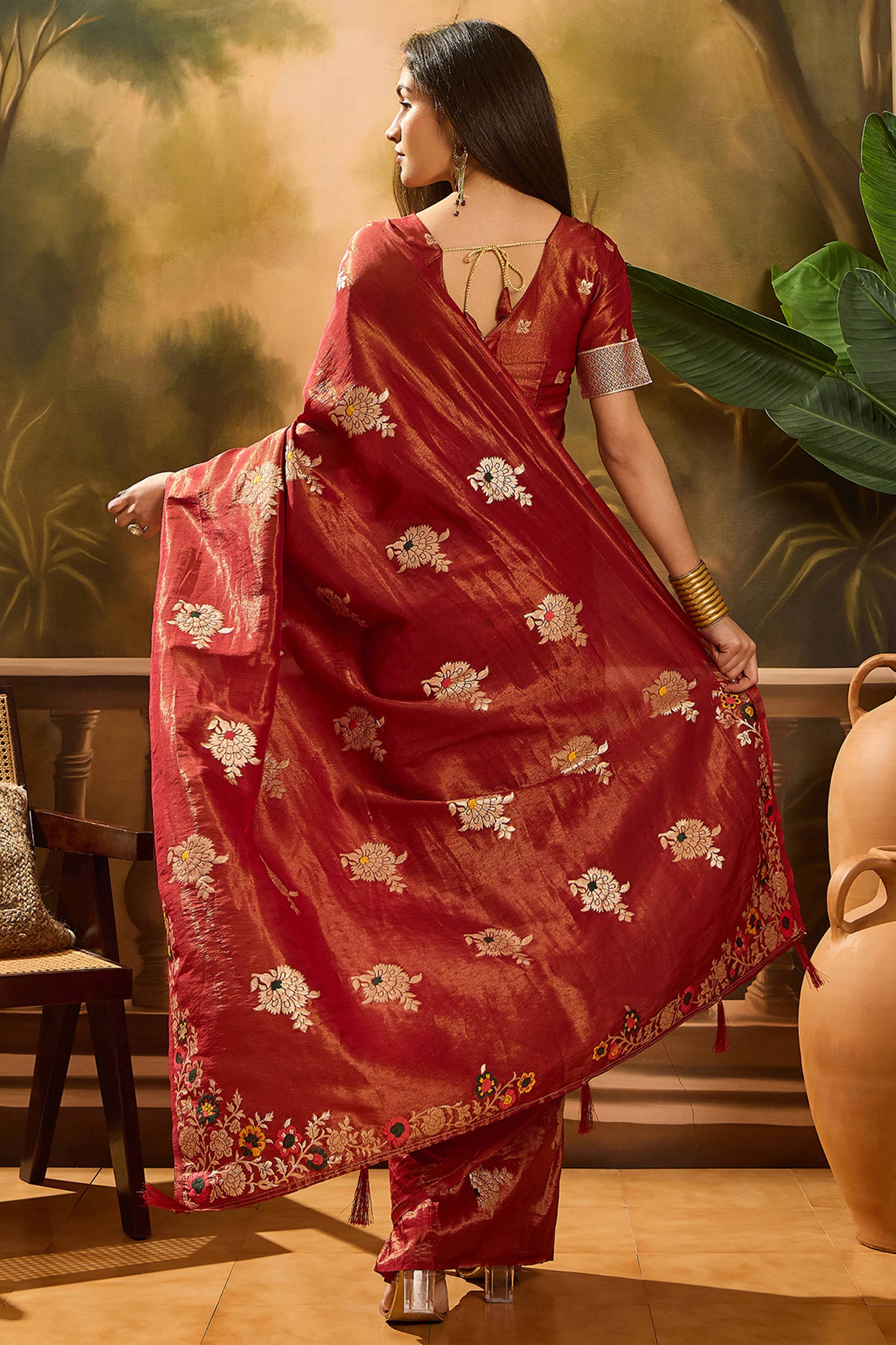 Maroon Shimmer Saree Featuring Intricate Floral Zari Weaving & Tassel Finish