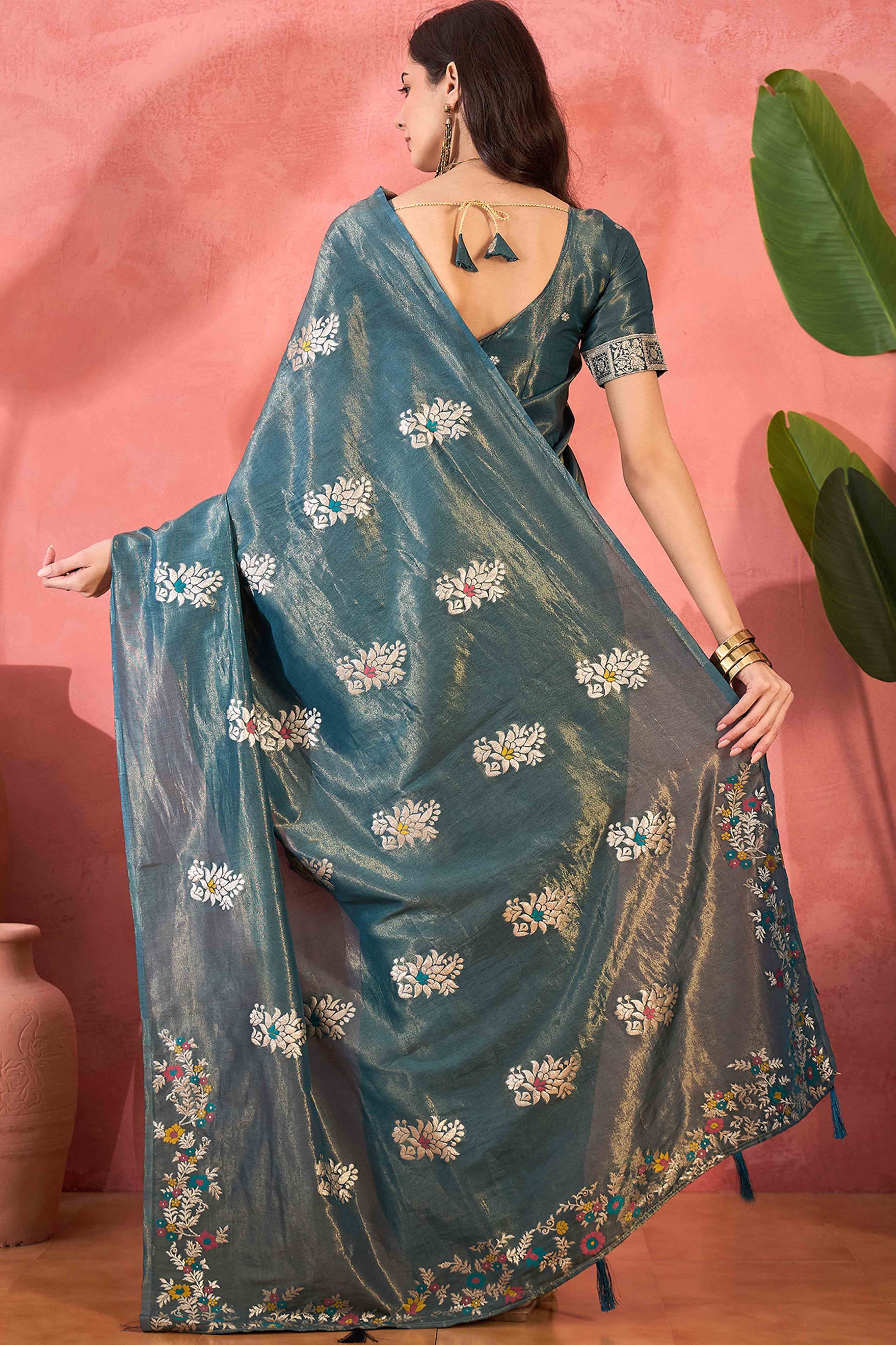 Teal Shimmer Saree Showcasing Floral Zari Weaving & A Tasselled Pallu