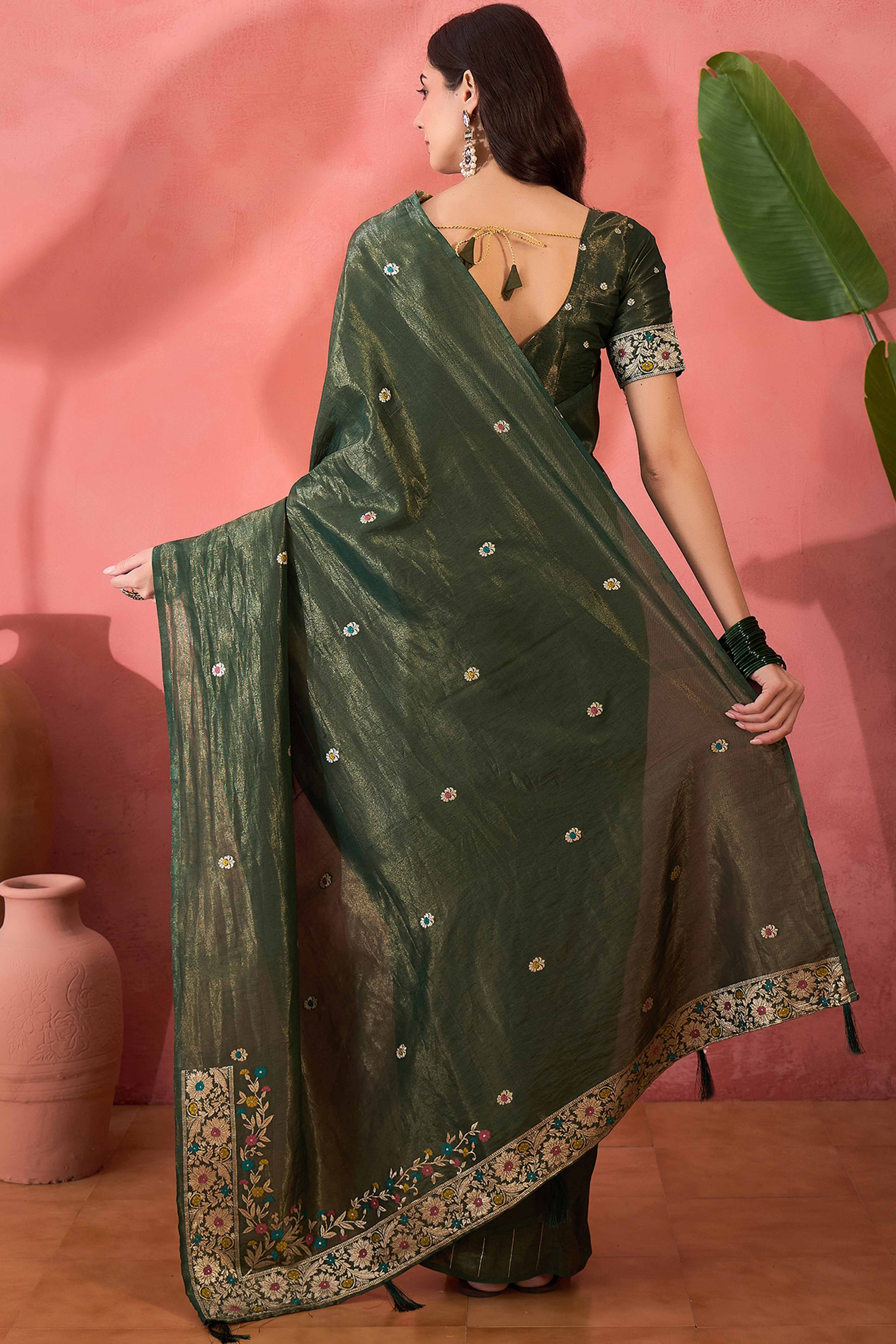 Green Zari Woven Shimmer Saree With Floral Motifs & Flowing Tassel Pallu