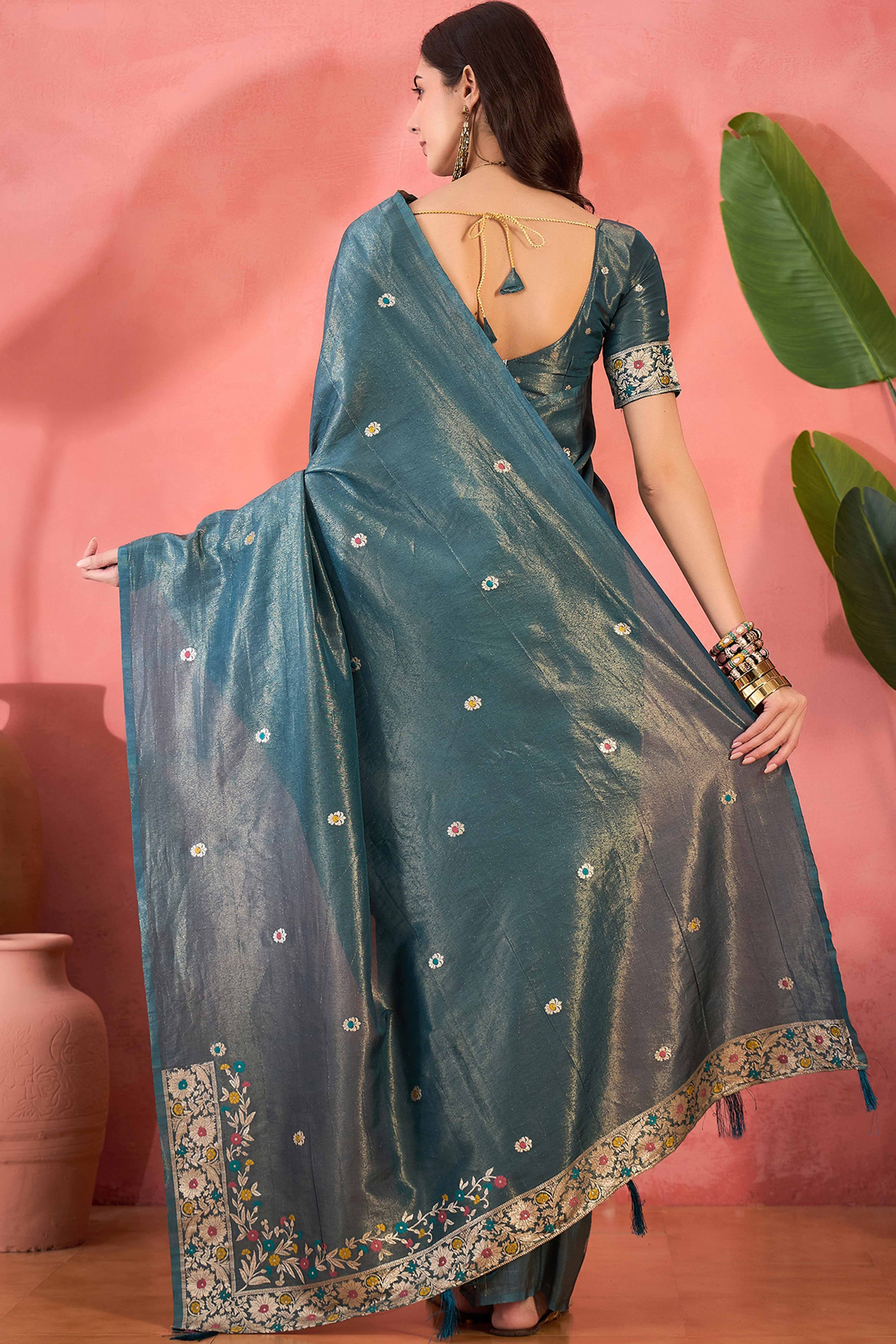 Teal Blue Zari Woven Shimmer Saree With Floral Motifs & Flowing Tassel Pallu