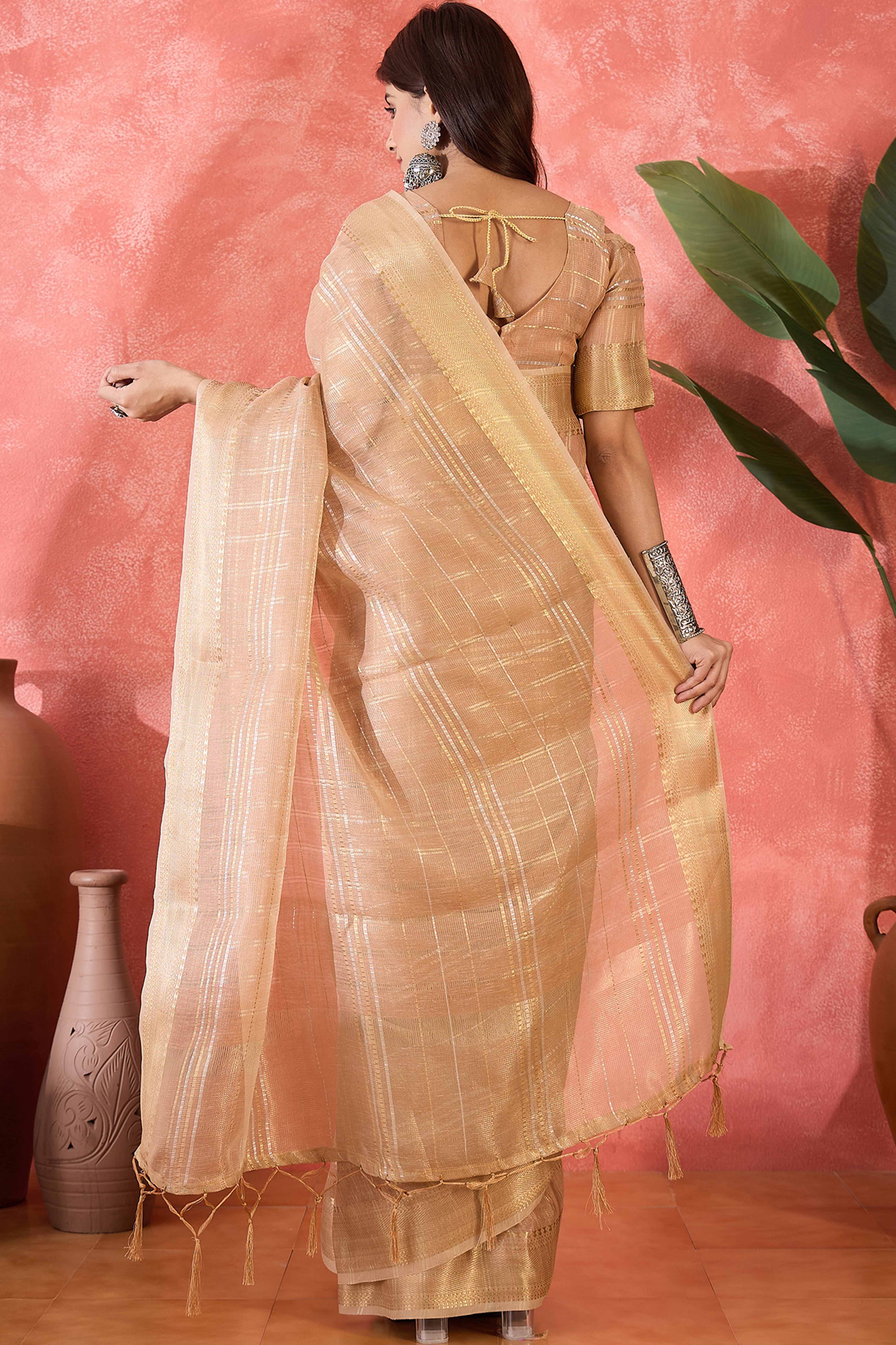 Light Peach Zari Woven Khadi Organza Saree Featuring Classic Checks & Tassel Detailing