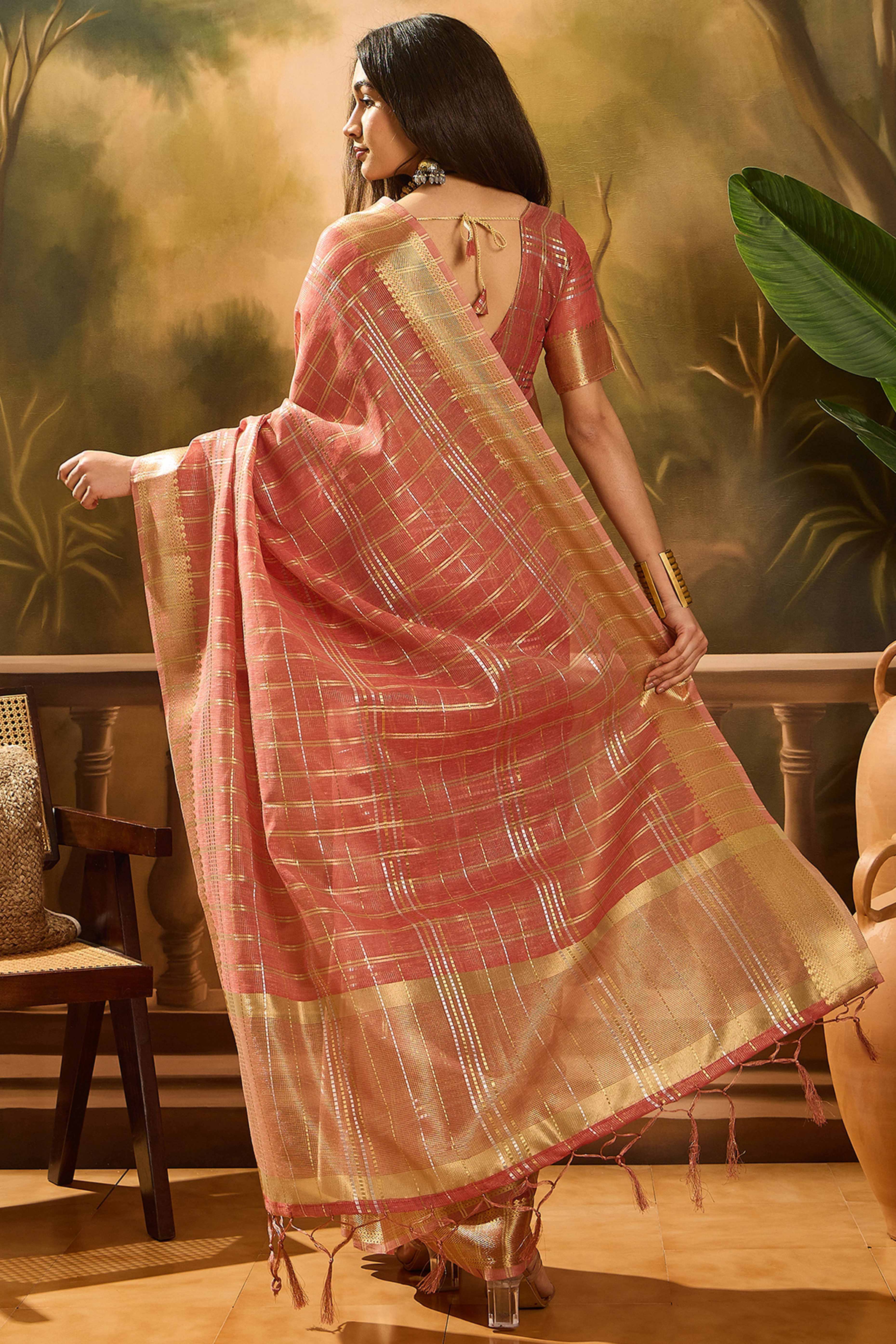 Peach Zari Woven Khadi Organza Saree Featuring Classic Checks & Tassel Detailing