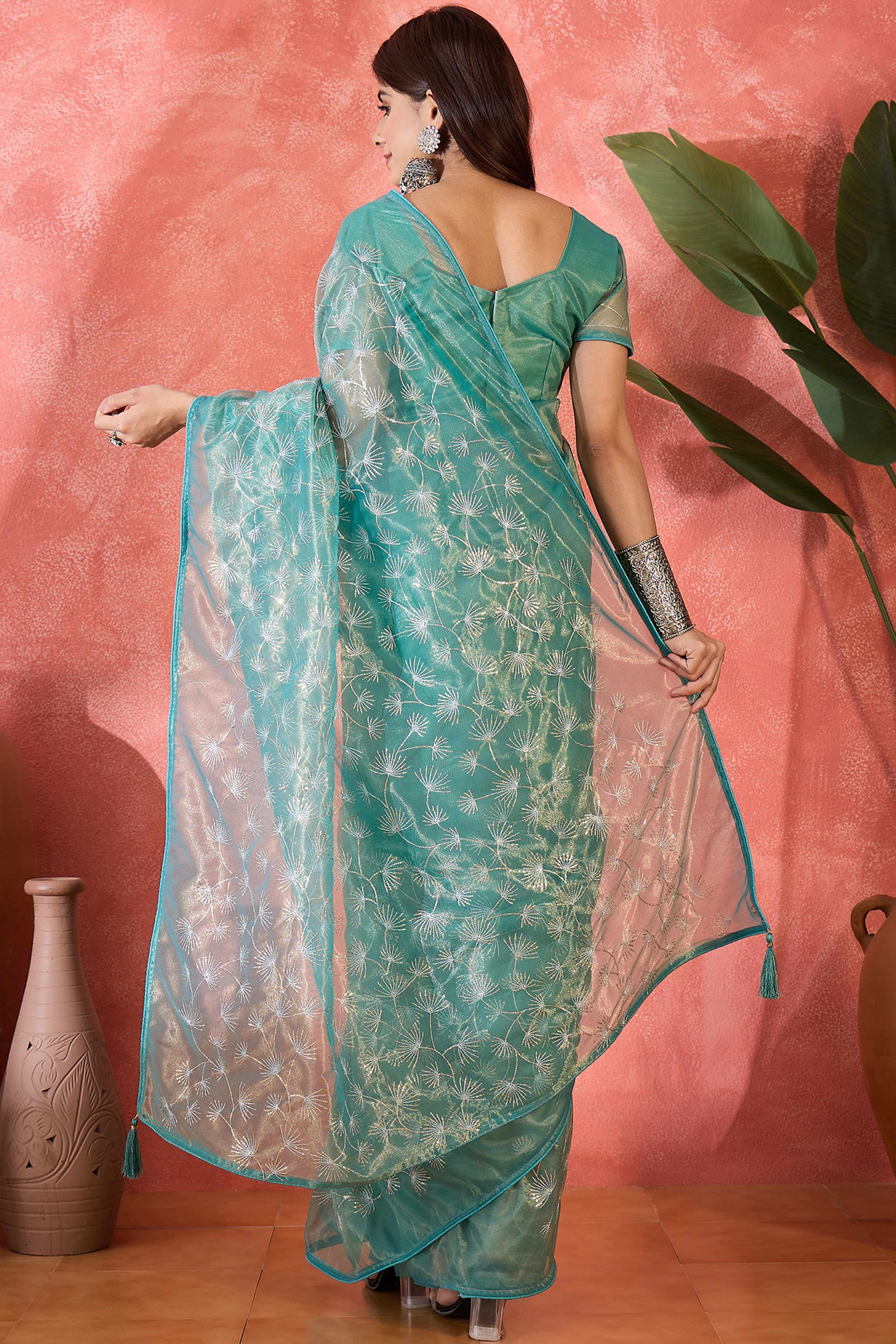 Turquoise Twill Net Saree With Intricate Floral Sequin Work & Flowing Tassel Pallu