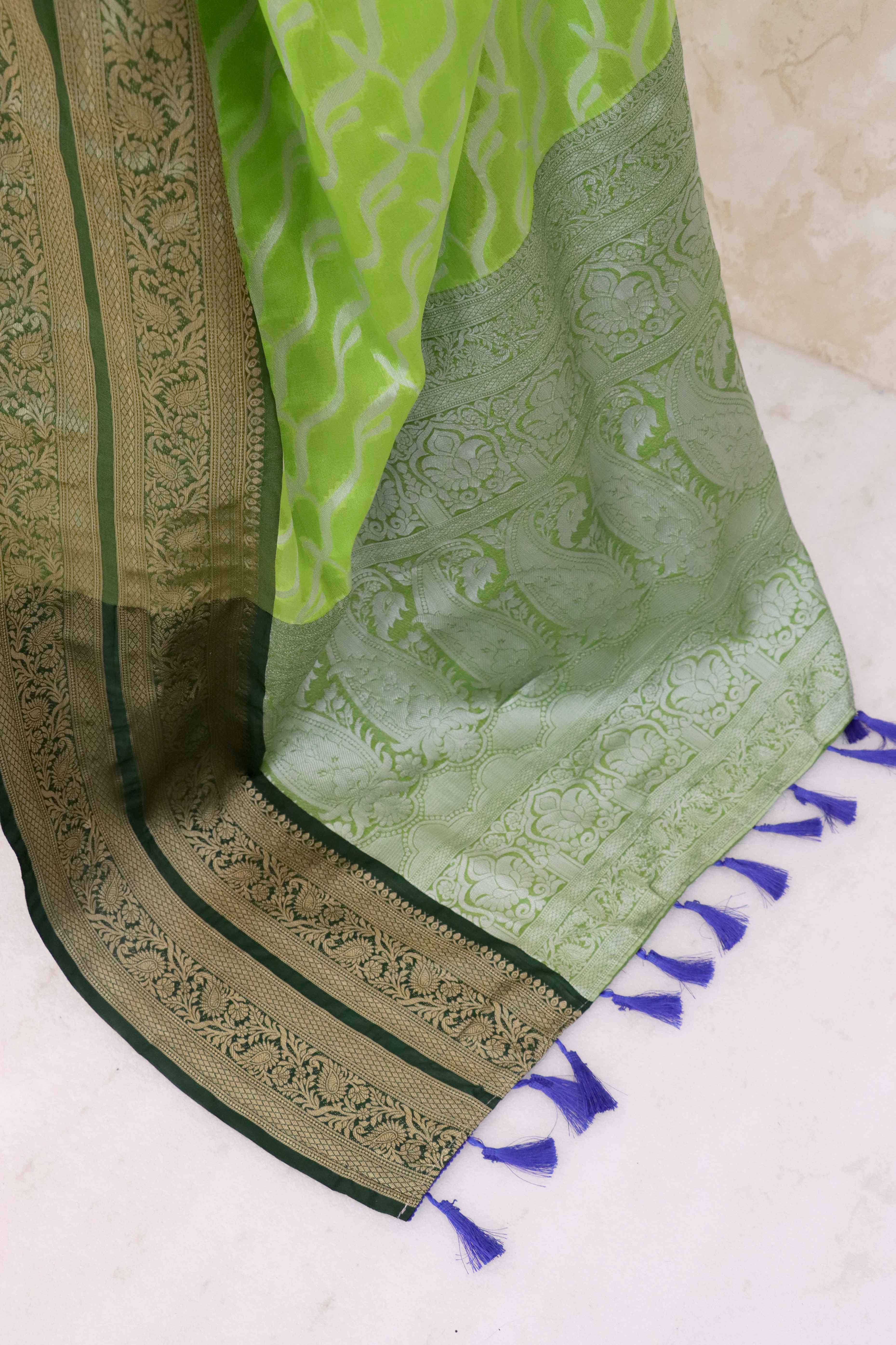 Parrrot Green Kanjivaram Silk Saree Adorned With Zari Weaving & Graceful Tassels