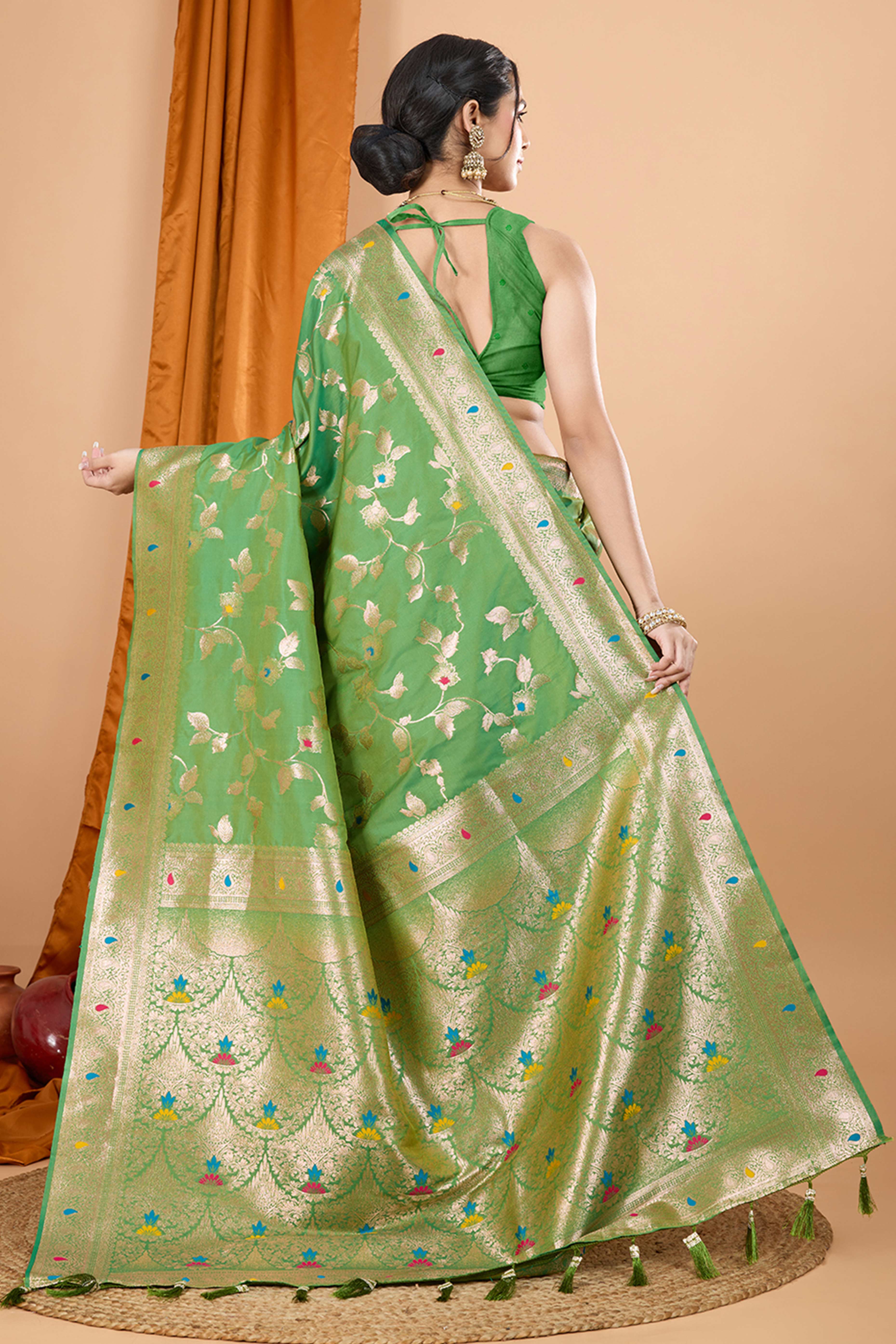 Green Banarasi Silk Saree With Exquisite Floral Zari Weaving and Elegant Tassels