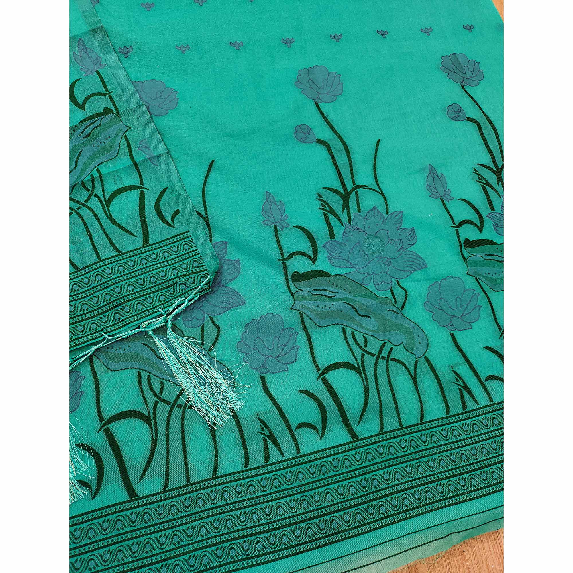 Sea Green Ethnic Dress Material Showcasing Handloom Style Floral Zari Weaving