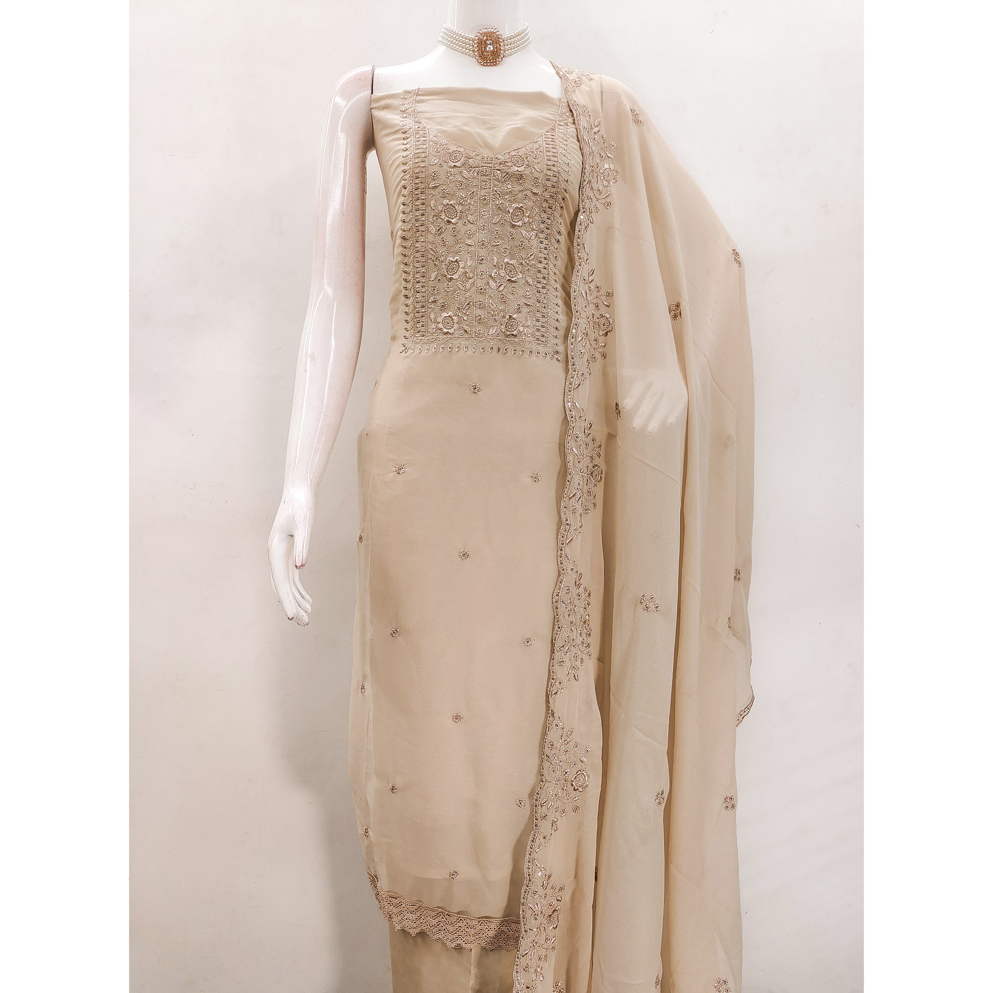 Chikoo Georgette Dress Material With Intricate Floral Zari Embroidery & Sequins Work