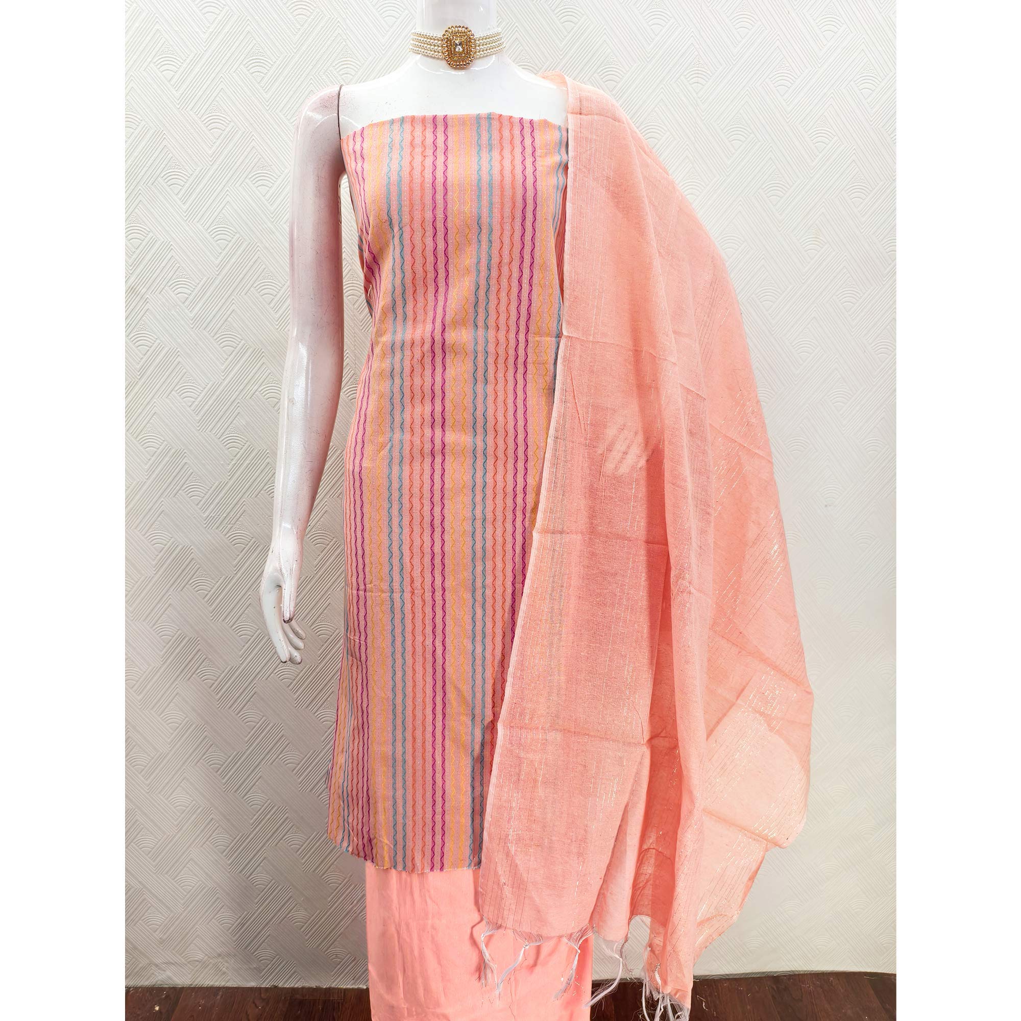 Peach Poly Cotton Blend  Dress Material Highlighted With Striped Woven Work