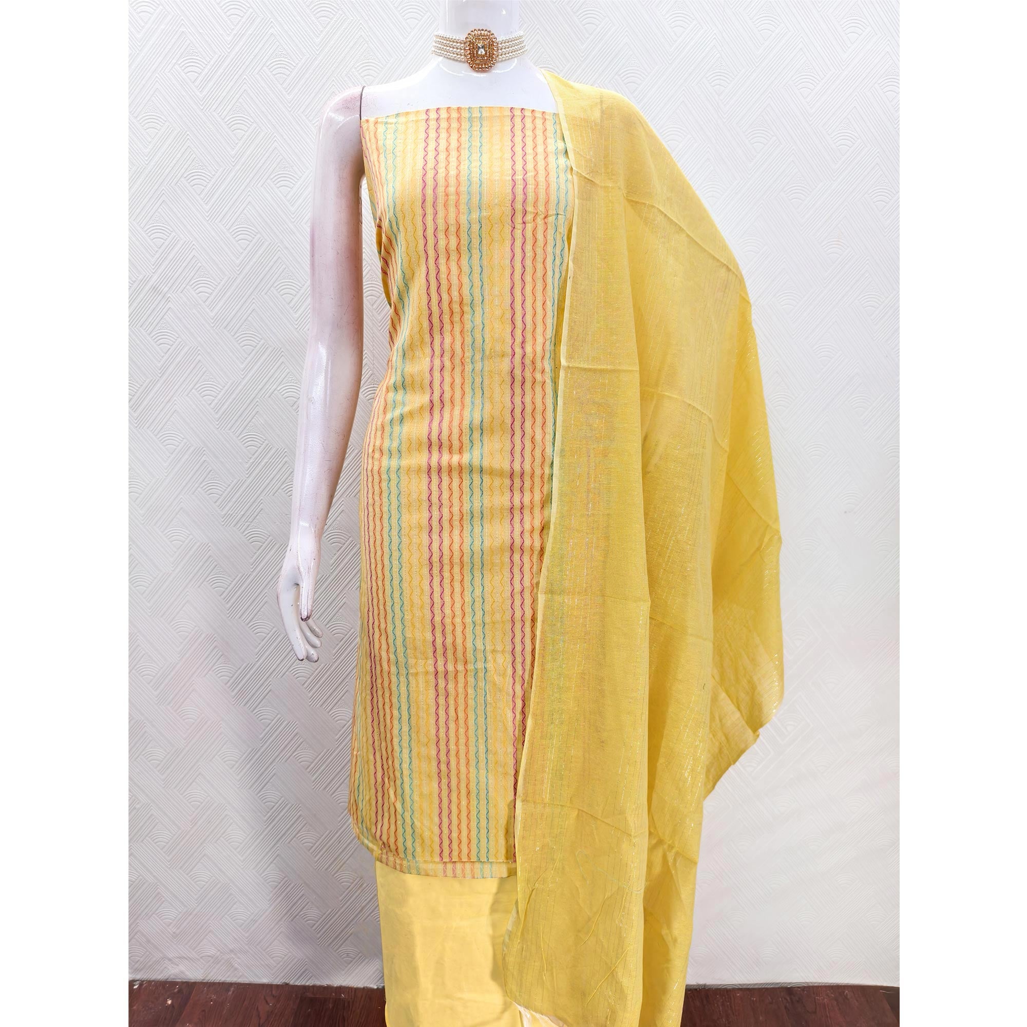 Yellow Poly Cotton Blend  Dress Material Highlighted With Striped Woven Work