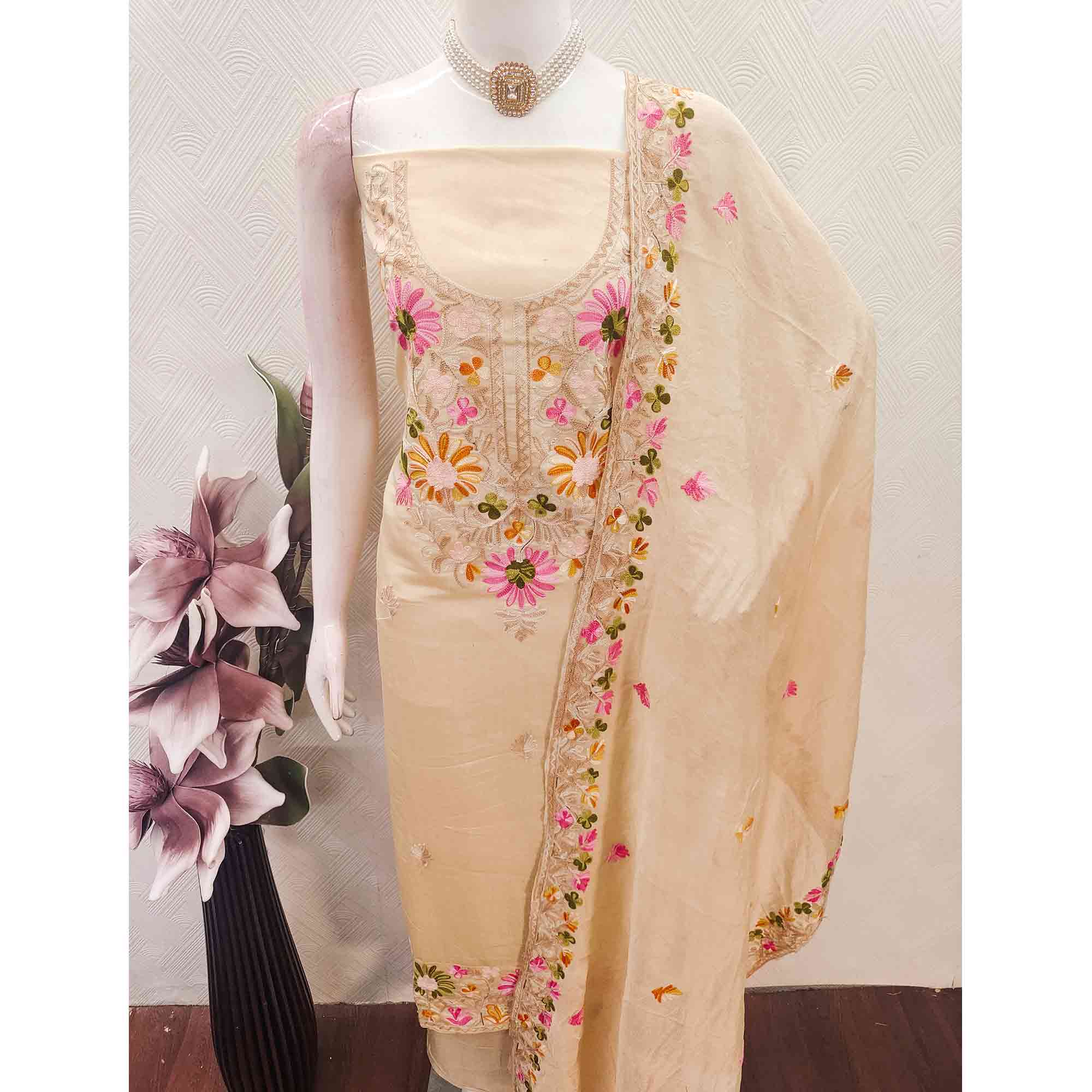 Chikoo Designer Roman Art Silk Dress Material Adorned With Floral Thread Embroidery Work