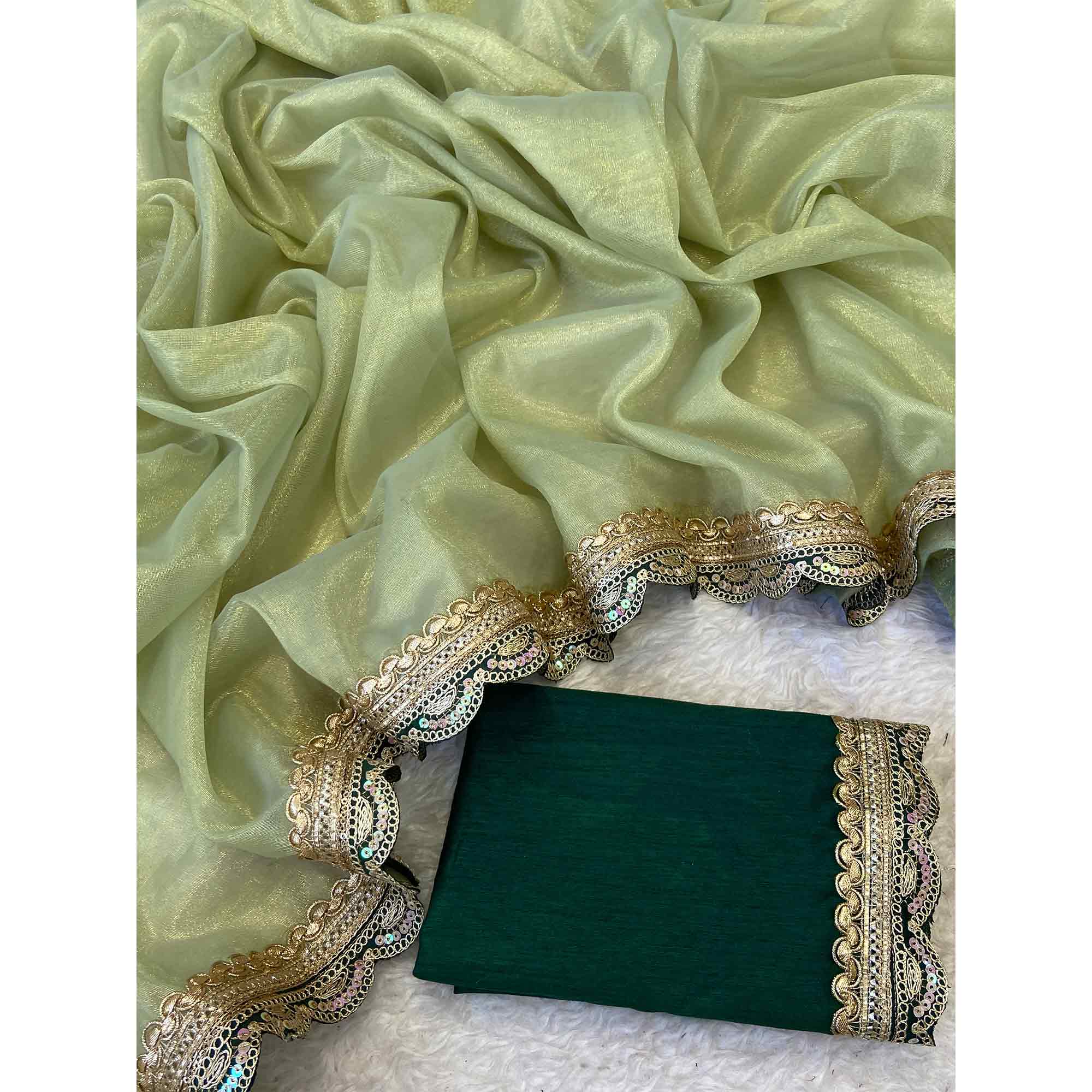 Pista Green Net Saree With Intricate Sequin Embroidery & Tassel Embellished Pallu