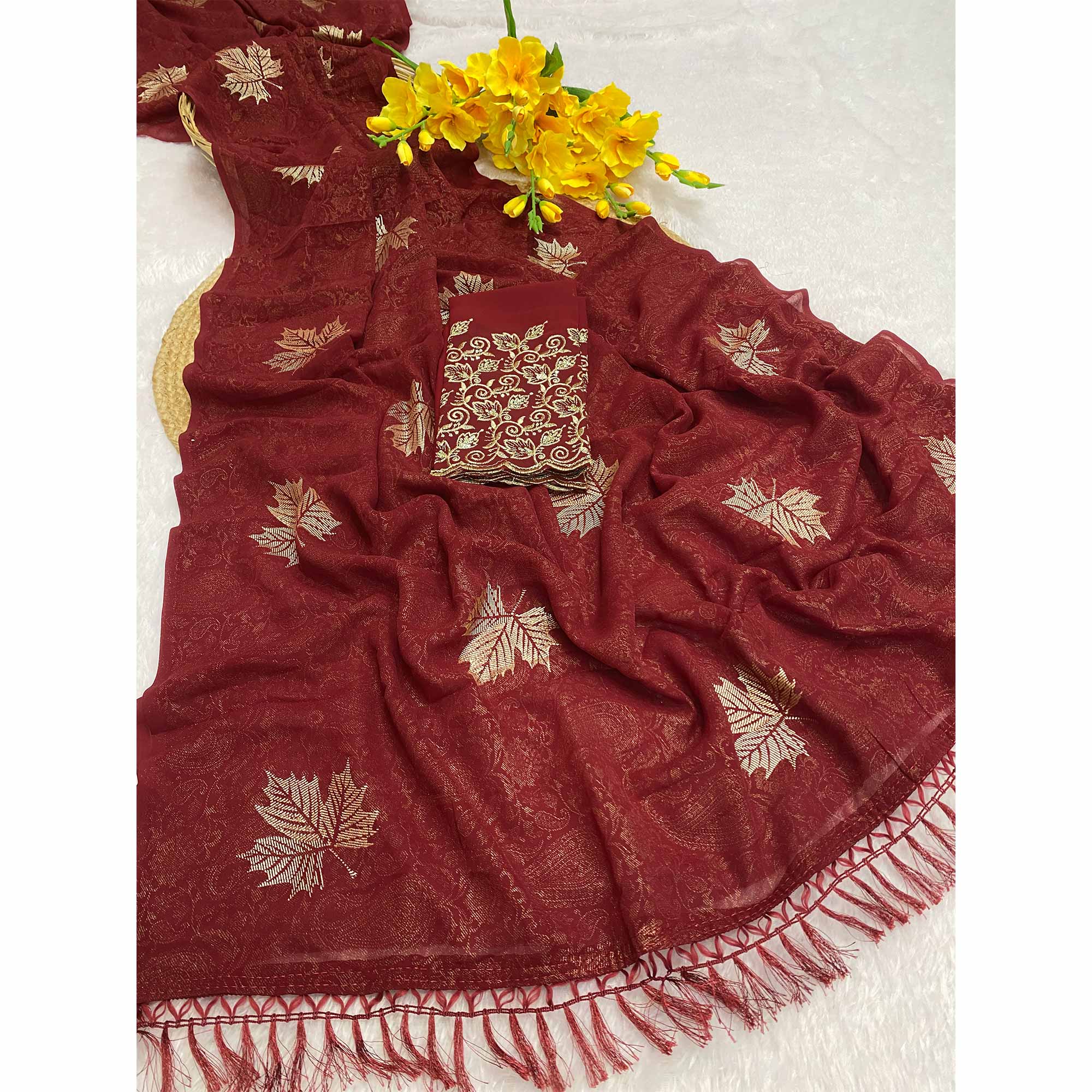 Maroon Georgette Saree With Foil Printed Paisley & Leaf Motifs Finished With A Tassel Pallu