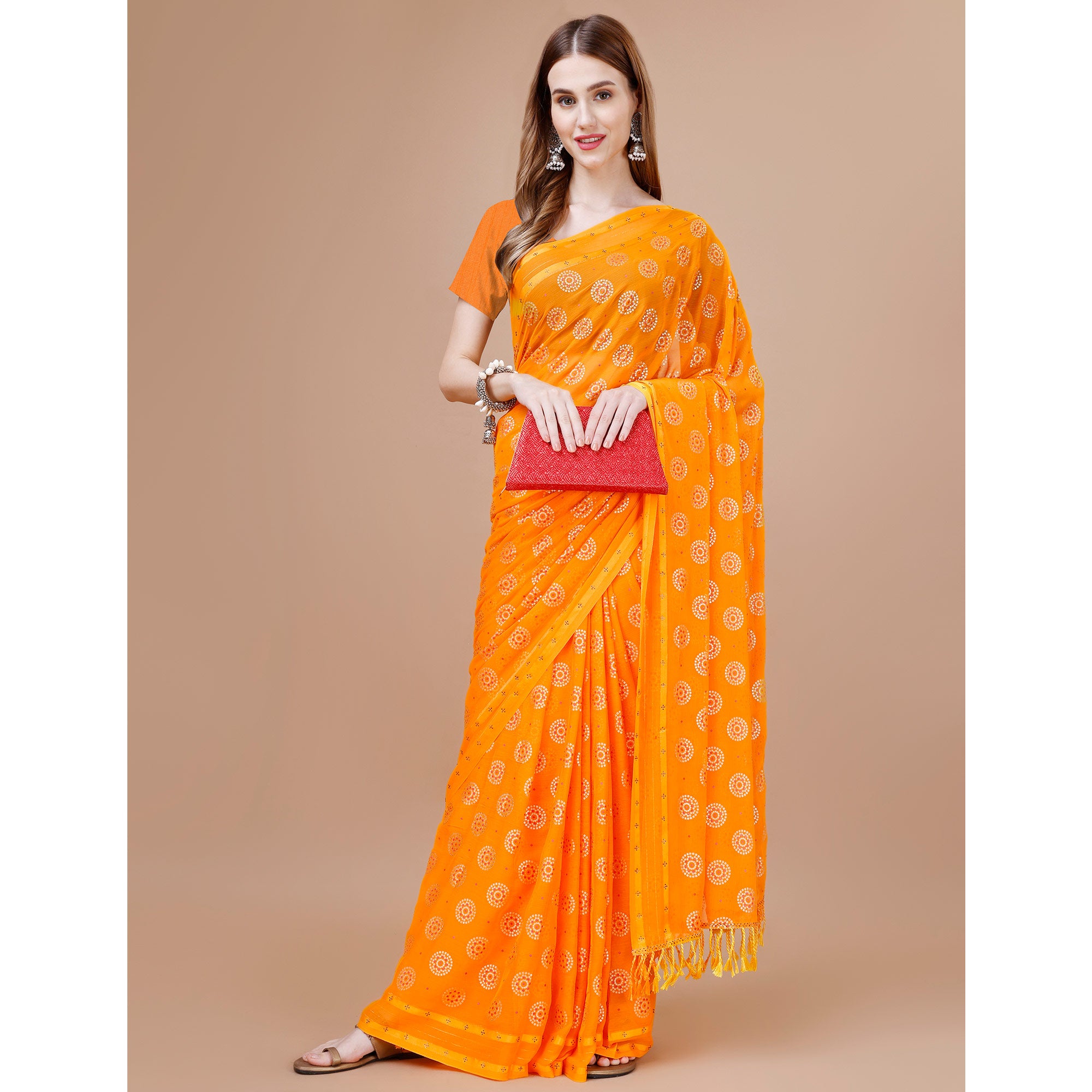 Orange Foil Printed Chiffon Saree With Tassels