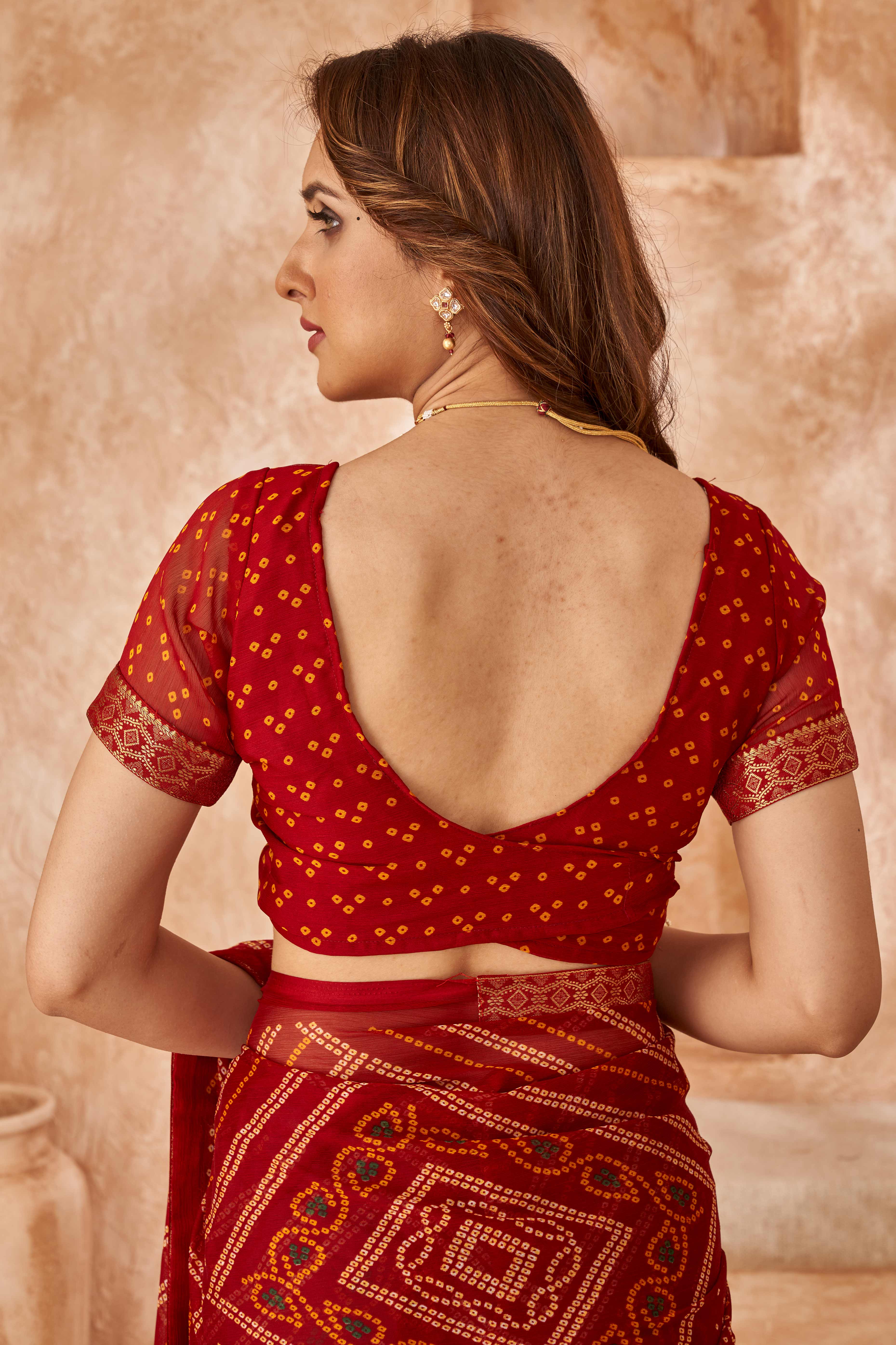 Maroon Chiffon Saree Featuring Traditional Bandhani Prints & A Graceful Lace Edge