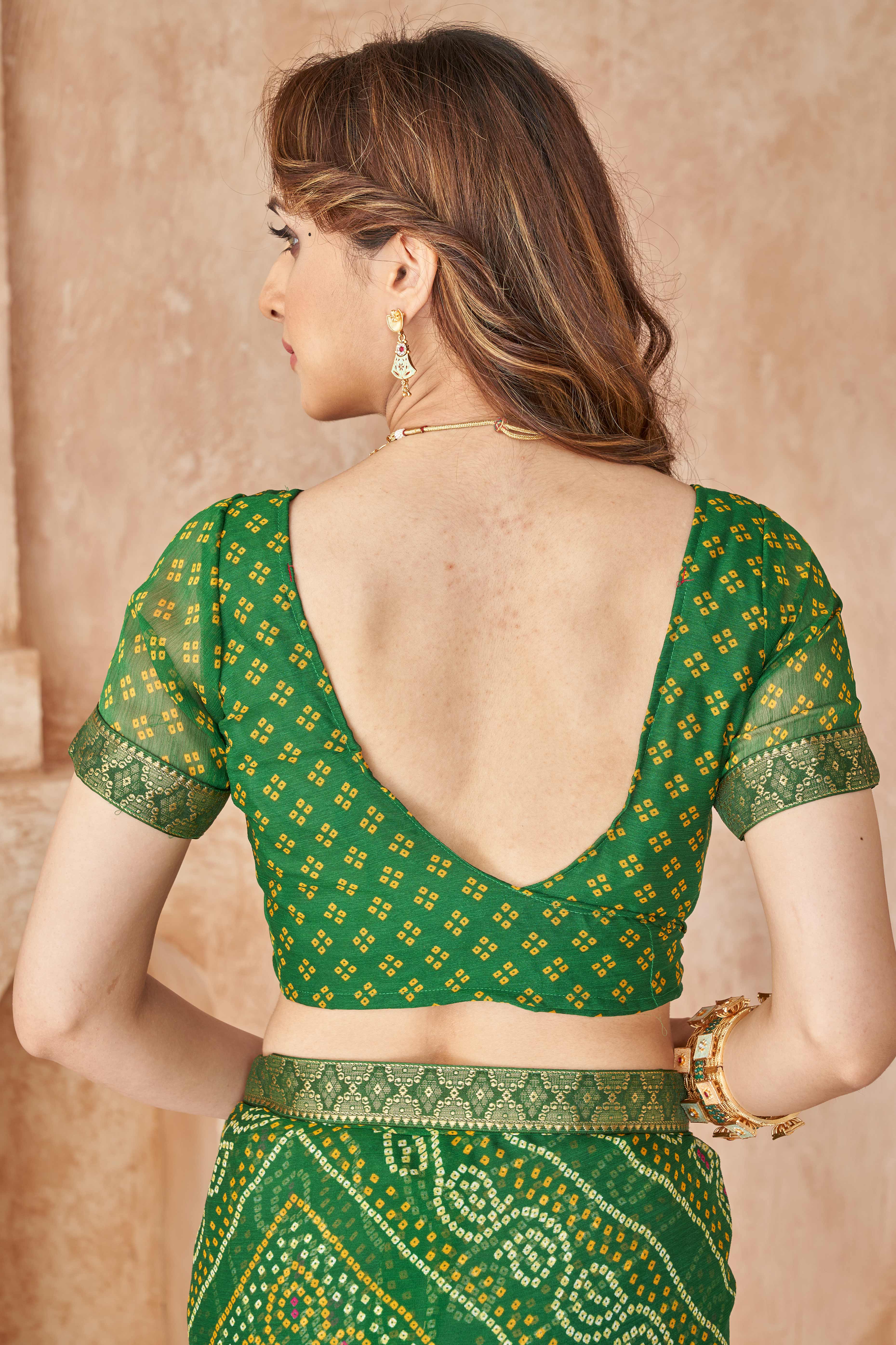 Green Chiffon Saree Featuring Traditional Bandhani Prints & A Graceful Lace Edge