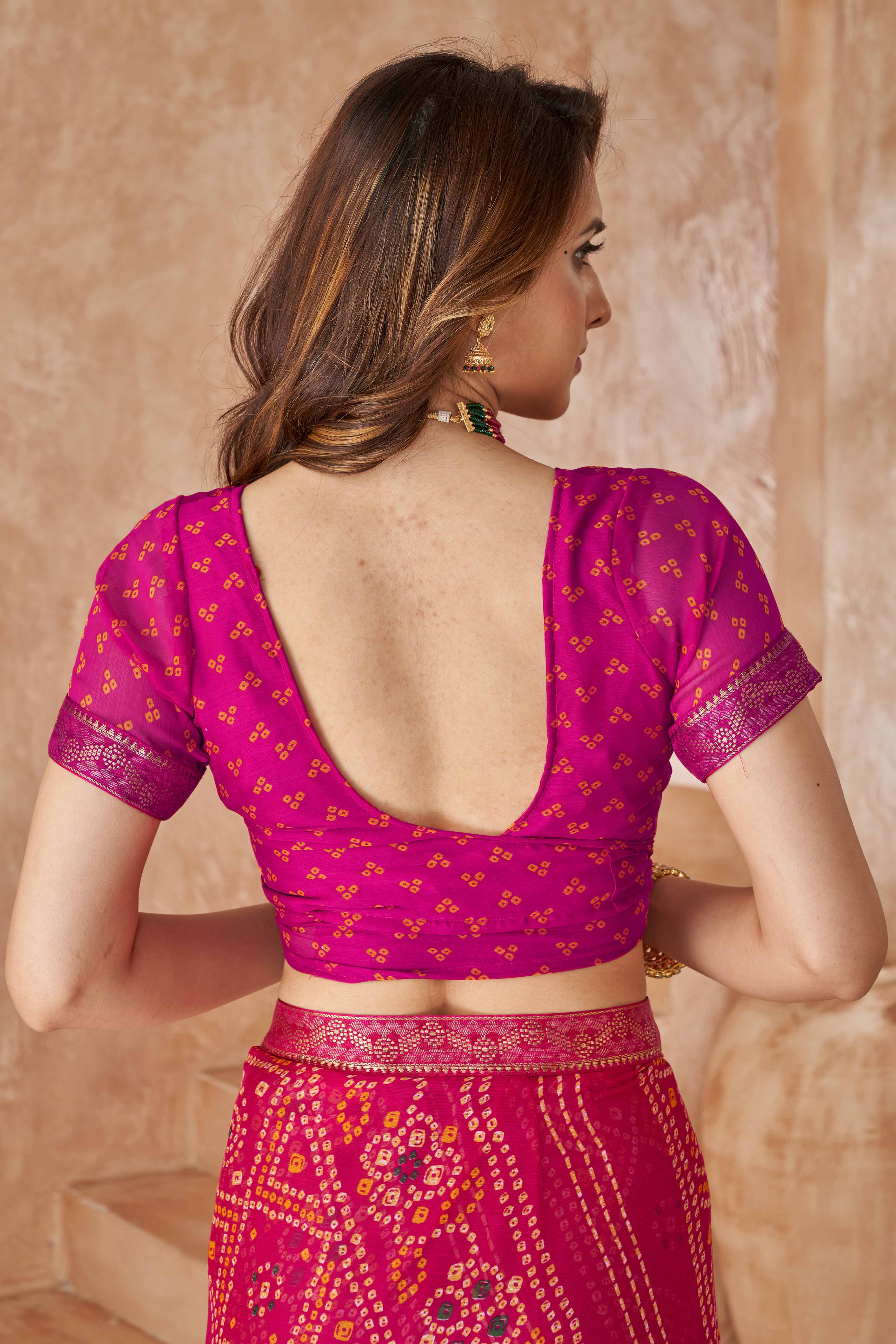 Magenta Chiffon Saree Featuring Traditional Bandhani Prints & A Graceful Lace Edge
