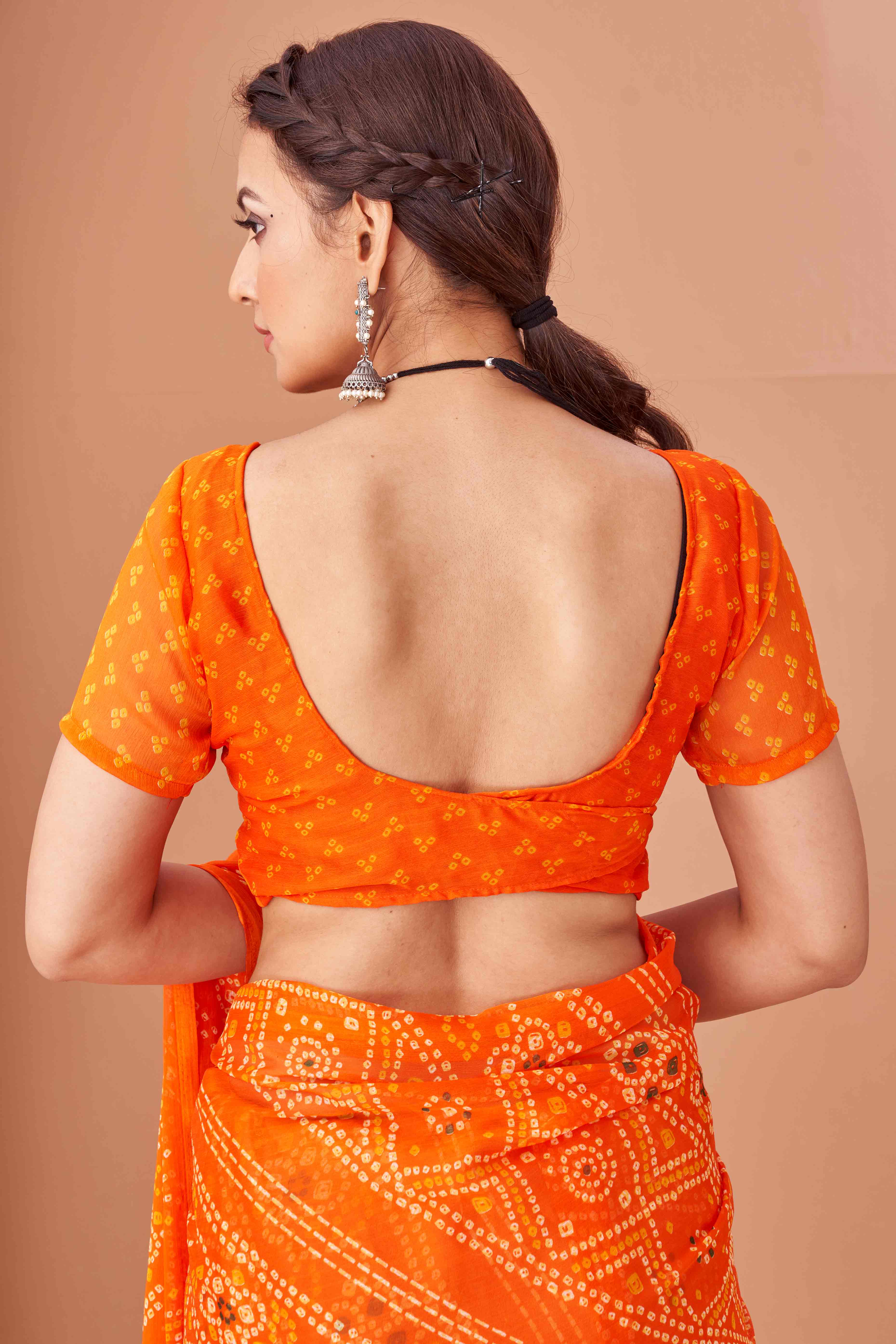 Orange Bandhani Printed Chiffon Saree Accented With Intricate Lace Border Work