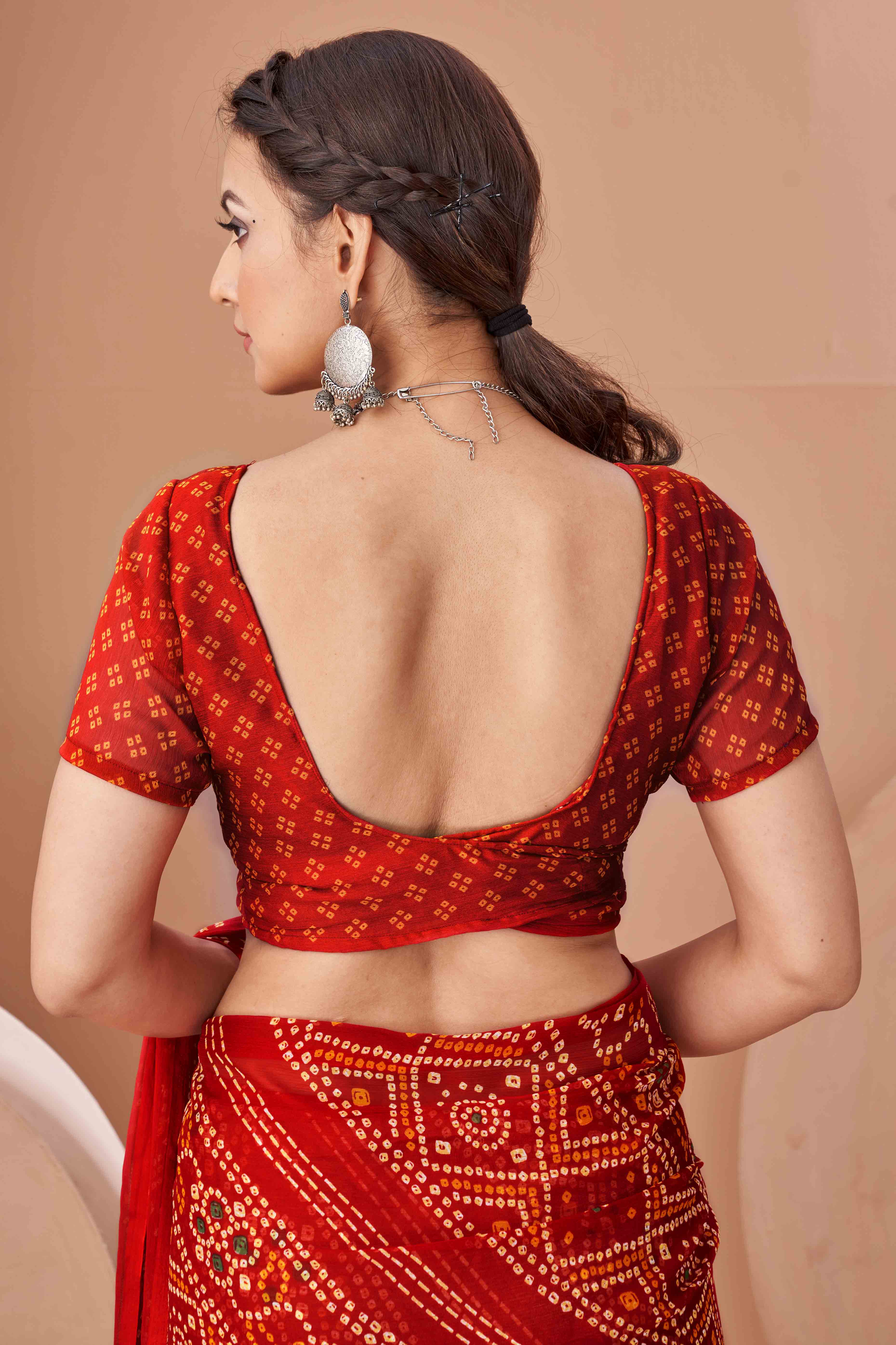 Red Bandhani Printed Chiffon Saree Accented With Intricate Lace Border Work