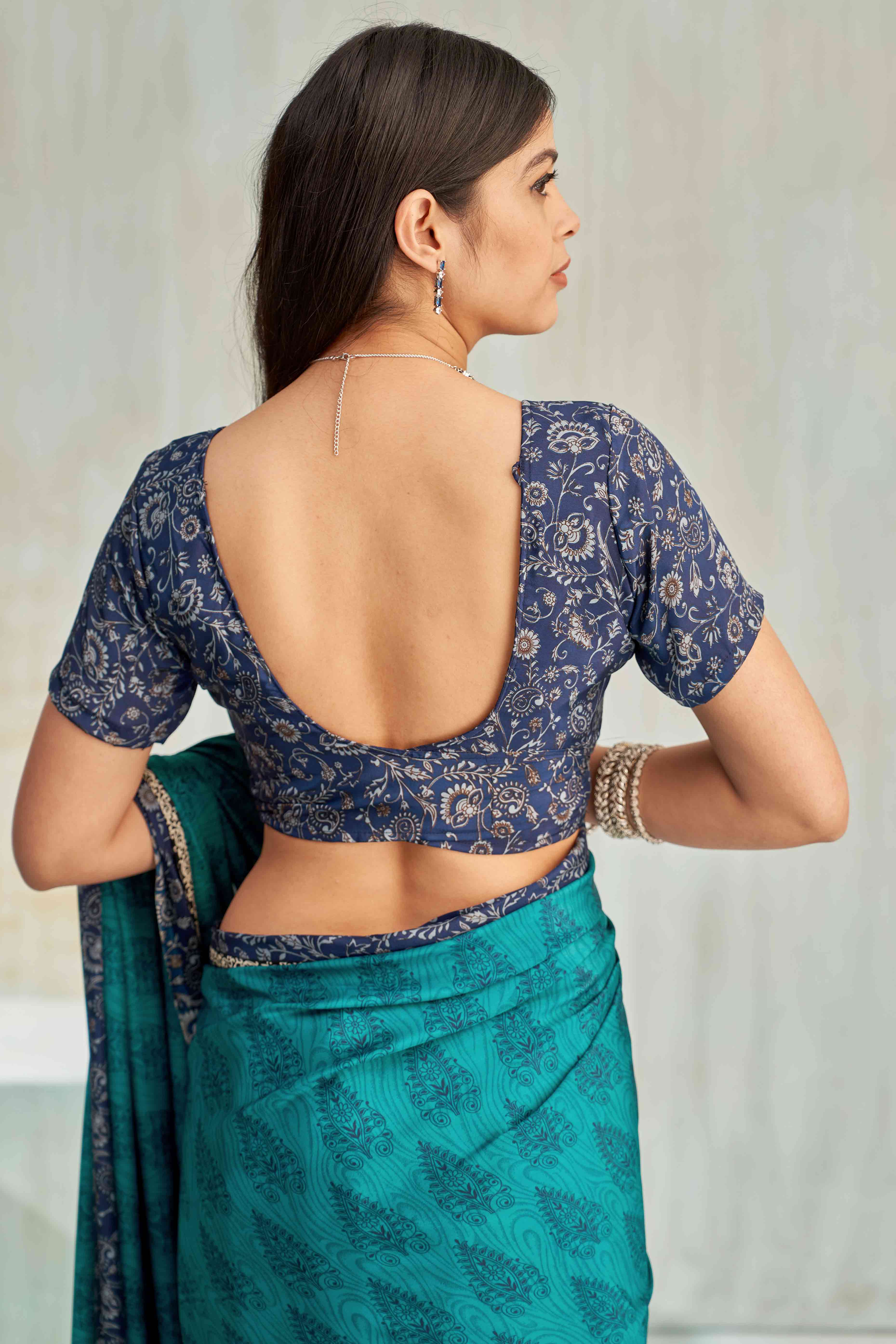 Teal Crepe Silk Saree Featuring Delicate Floral Print Work