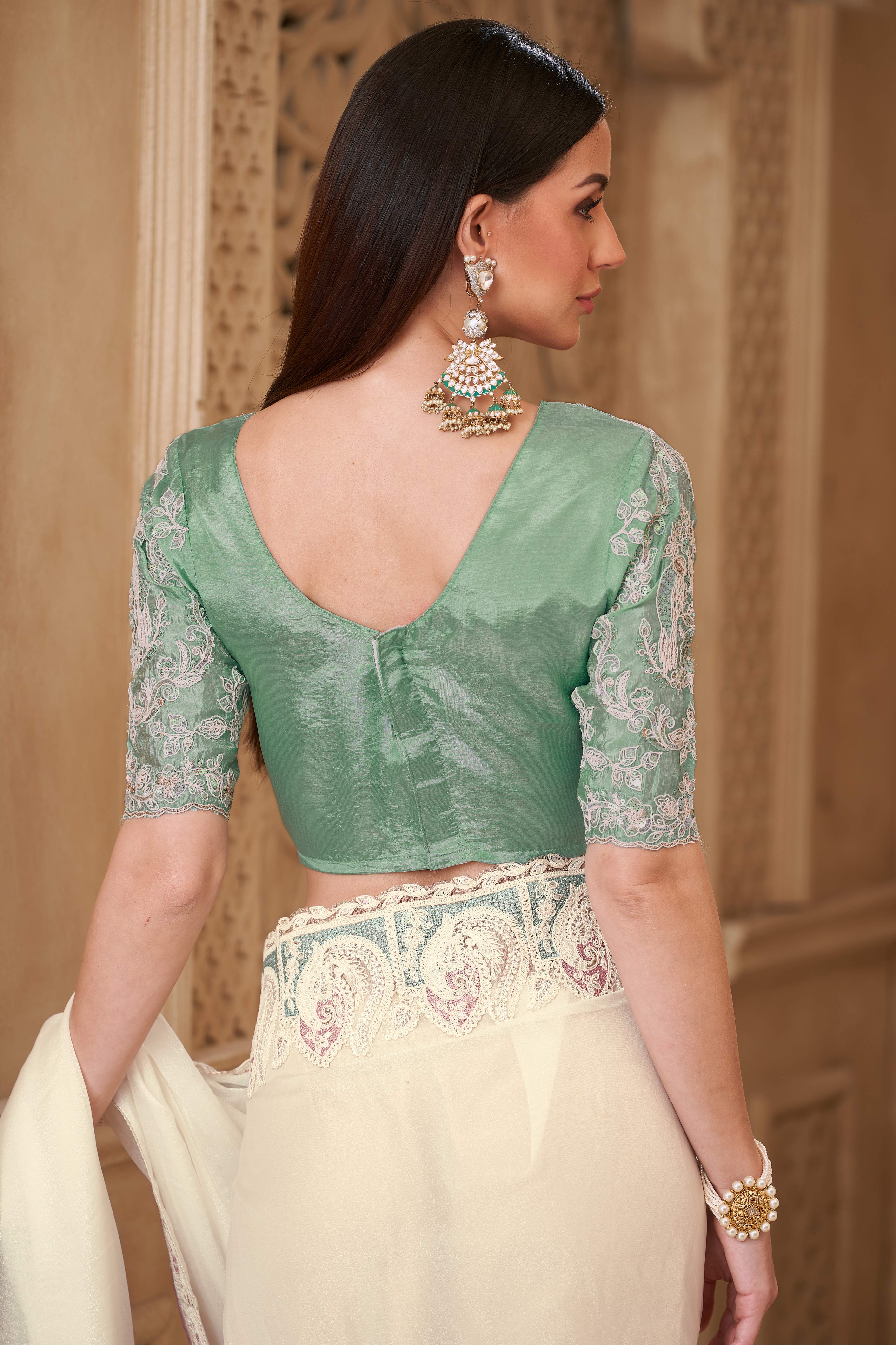 Shimmering Cream Georgette Saree with Graceful Thread Embellishment and Sequins