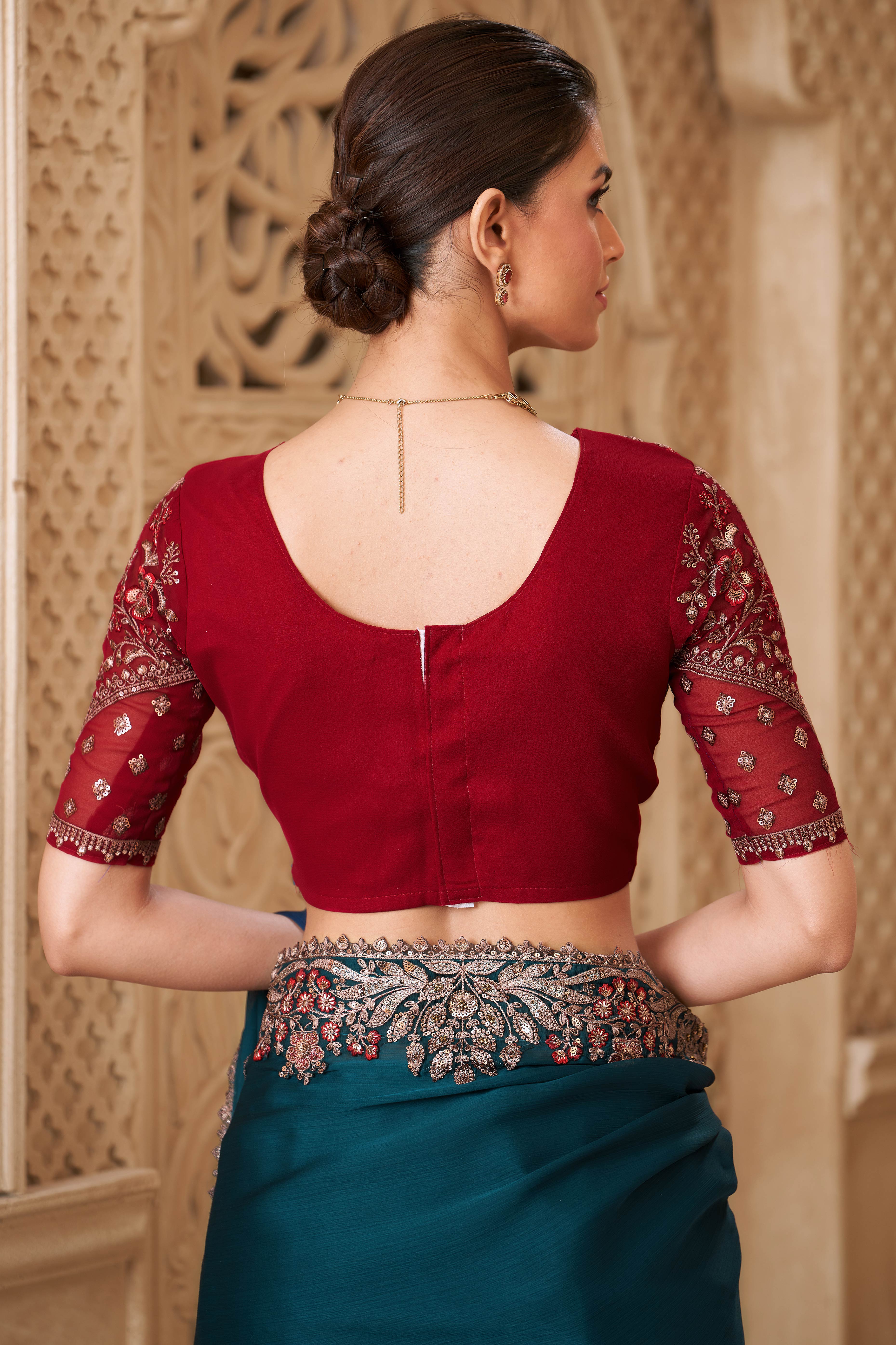 Shimmering Teal Georgette Saree with Graceful Thread Embellishment and Sequins