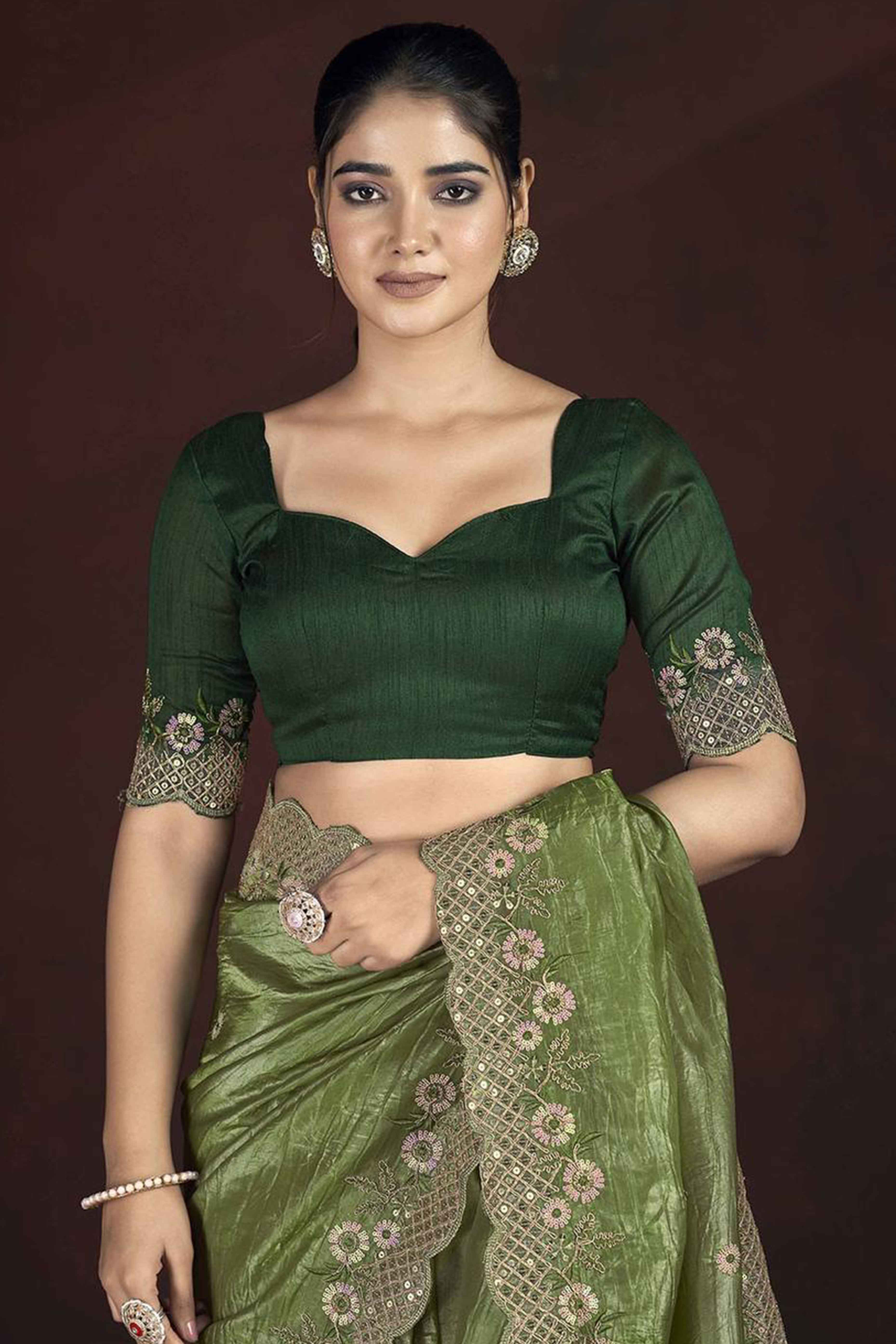 Green Organza Saree with Embroidery on the Edges for a Graceful Contemporary Look