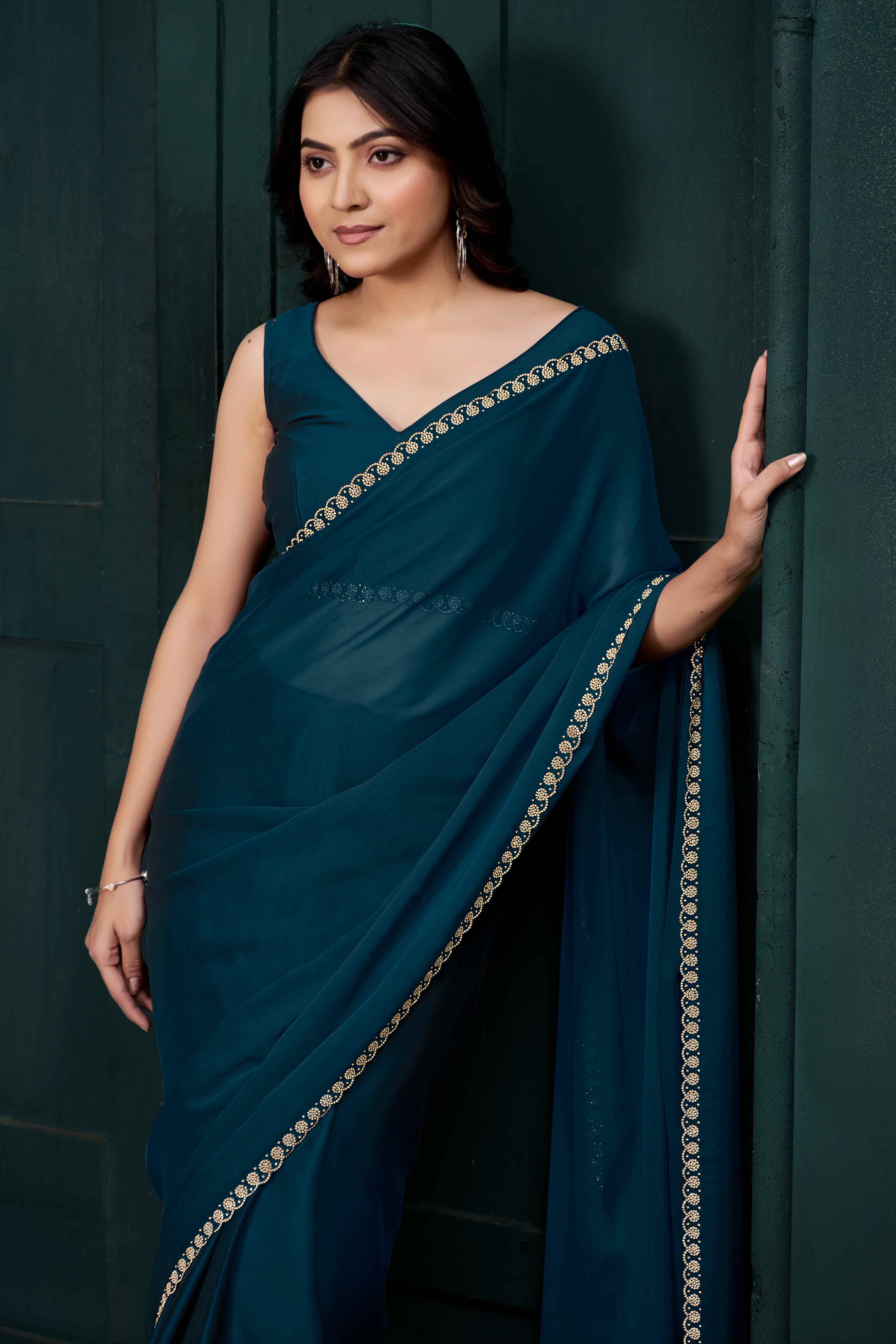 Petrol Blue Crepe Silk Solid Saree with Elegant Zarkan Border Detailing