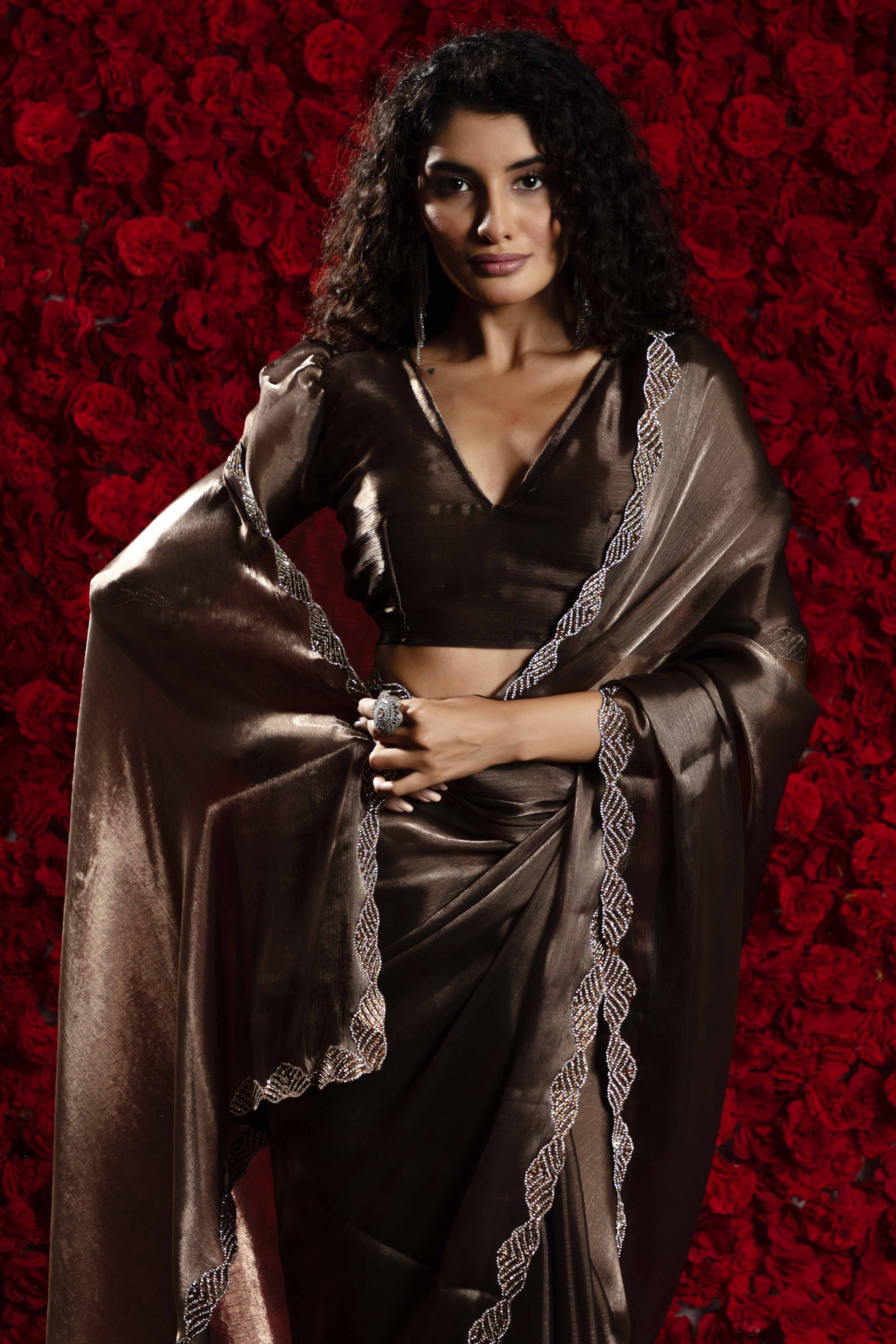 Dark Brown Solid Tissue Chiffon Saree Accentuated With A Sparkling Zarkan Work Border