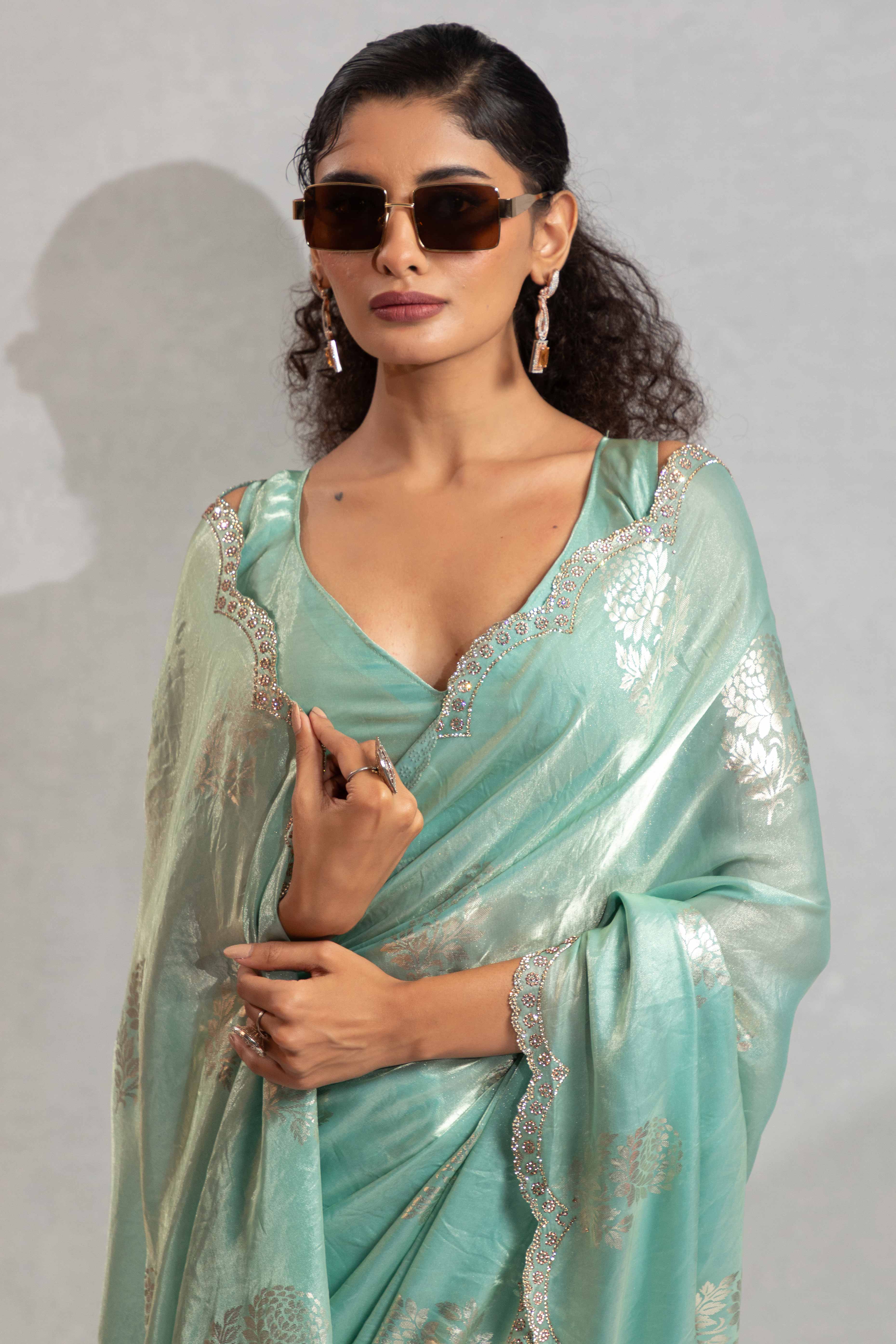Turquoise Satin Silk Saree Showcasing Elegant Floral Foil Prints & Dazzling Zarkan Work
