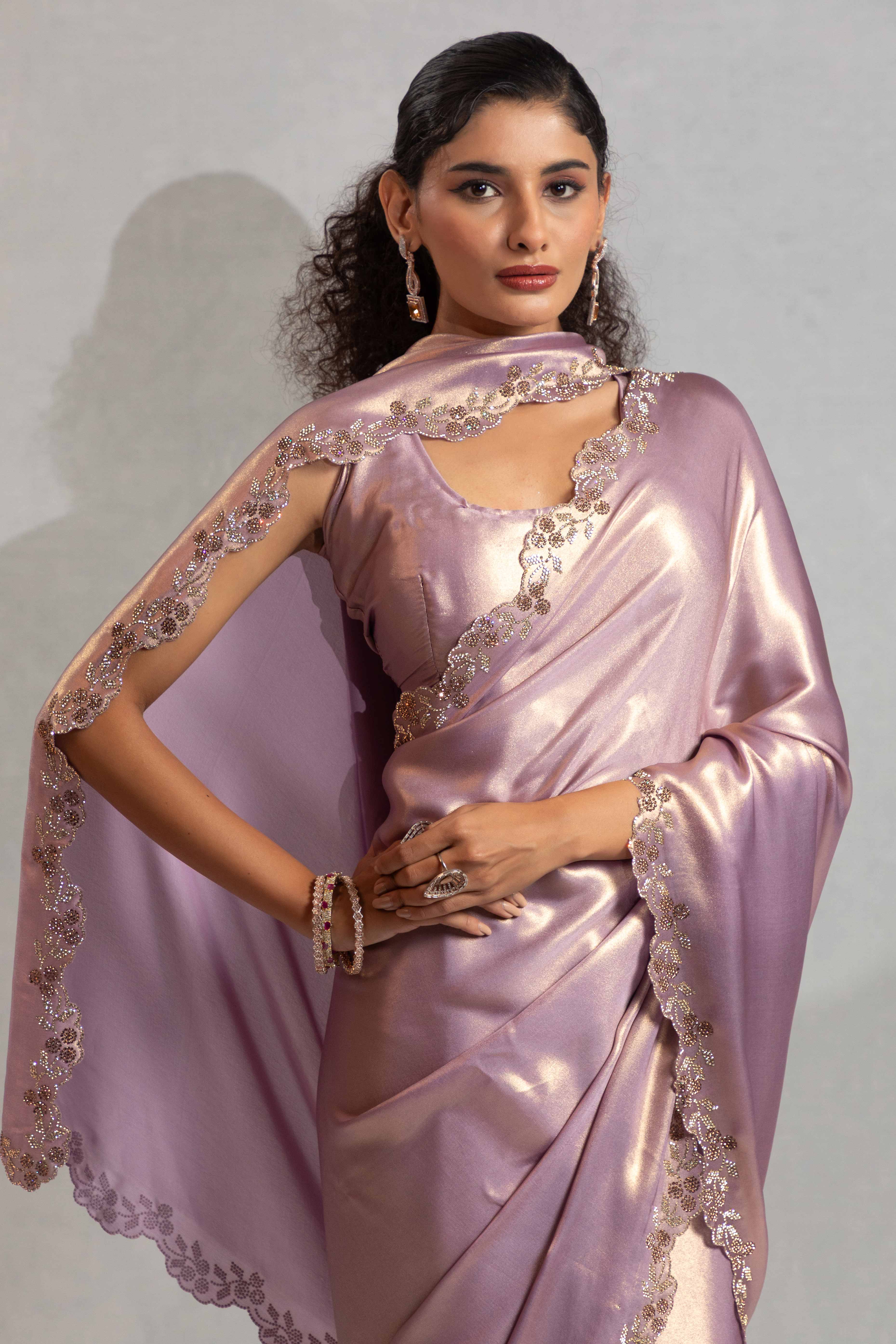 Lavender Satin Georgette Saree Adorned With Subtle Foil Finish & A Sparkling Zarkan Work Border