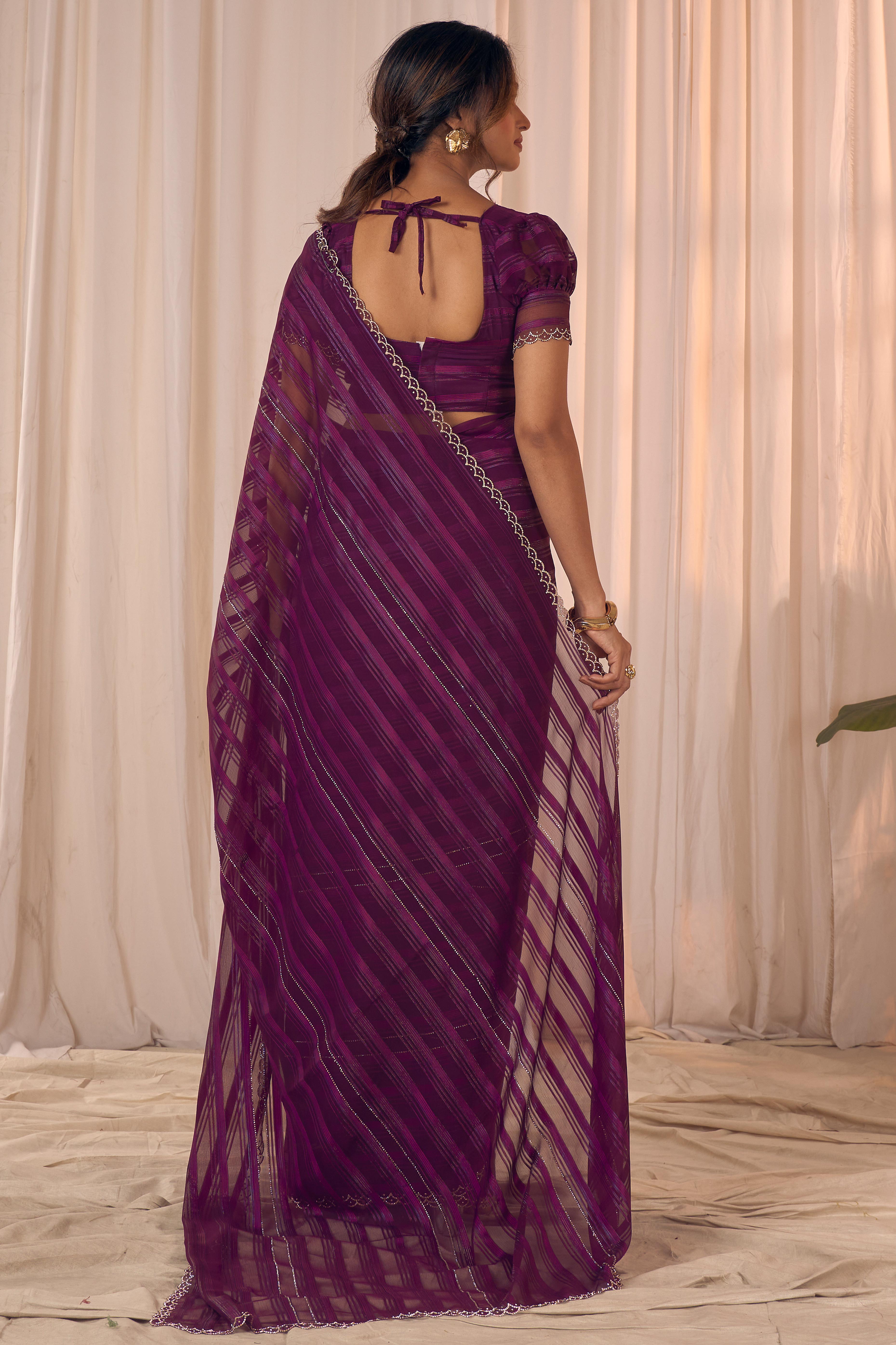 Wine Striped Designer Georgette Saree Adorned With An Elegant Zarkan Cutwork Border