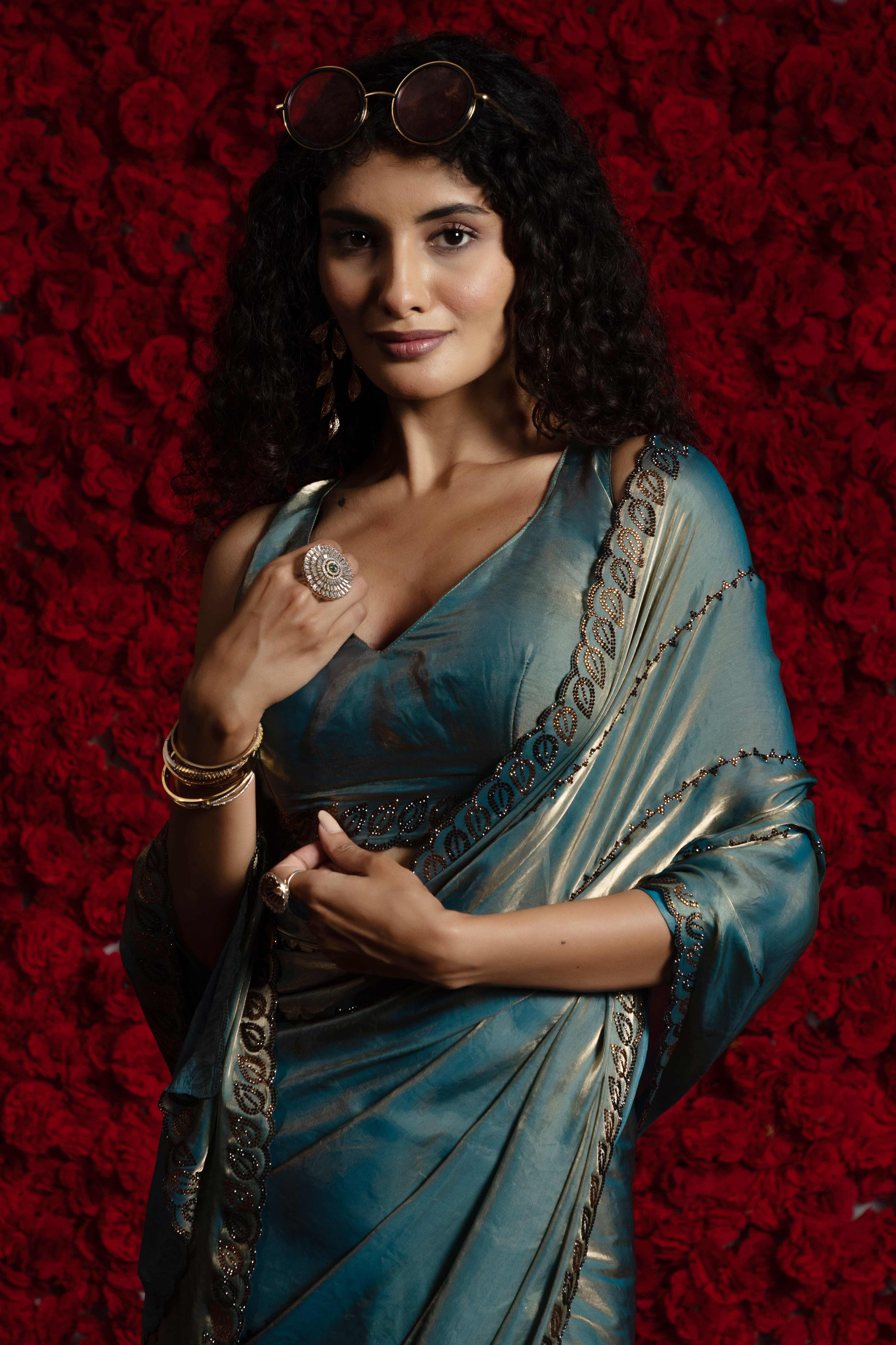 Teal Satin Silk Saree with Dazzling Stone Embellishments for Special Occasions