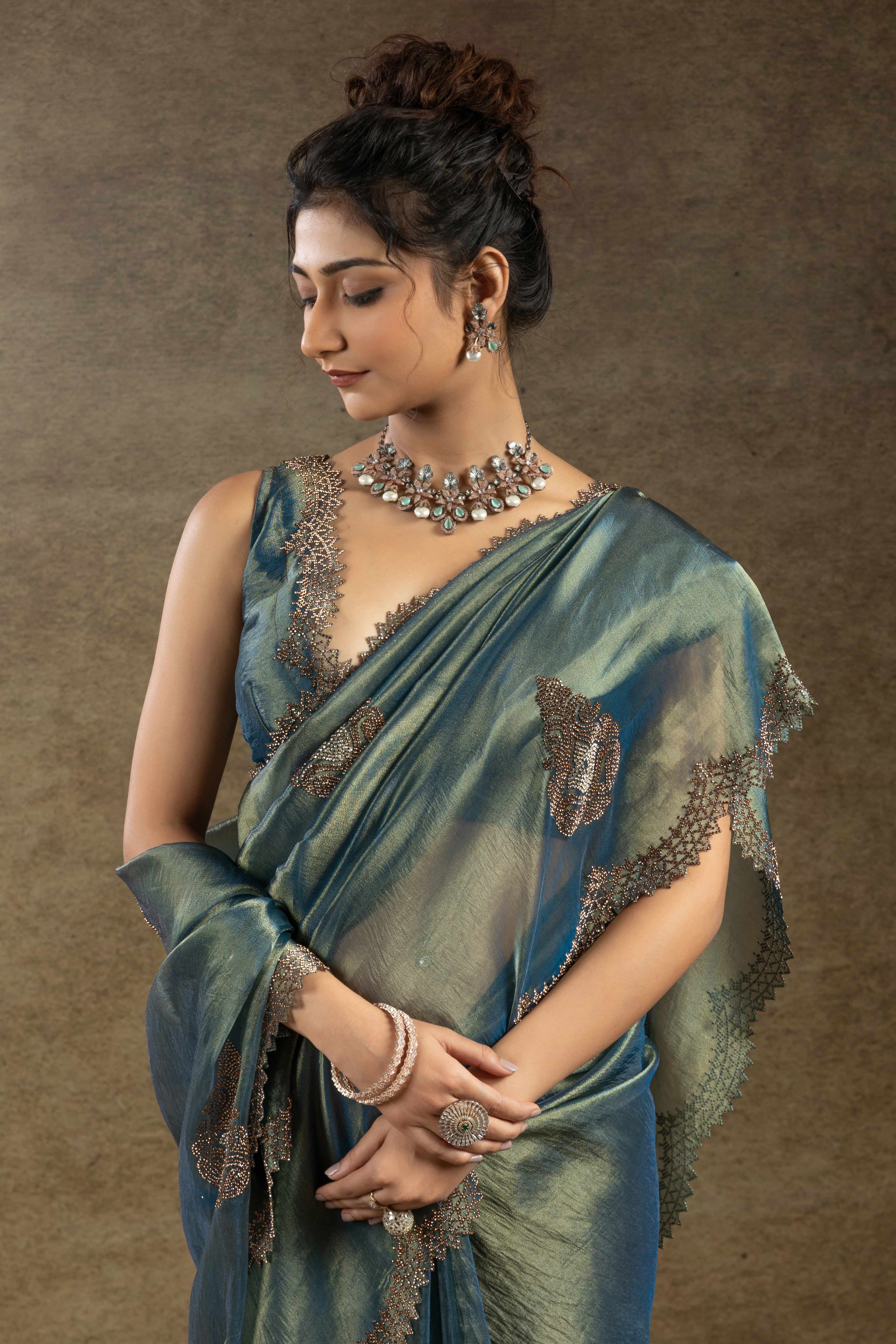 Teal Banarasi Silk Saree with Stone Embellishments Perfect for Party Wear