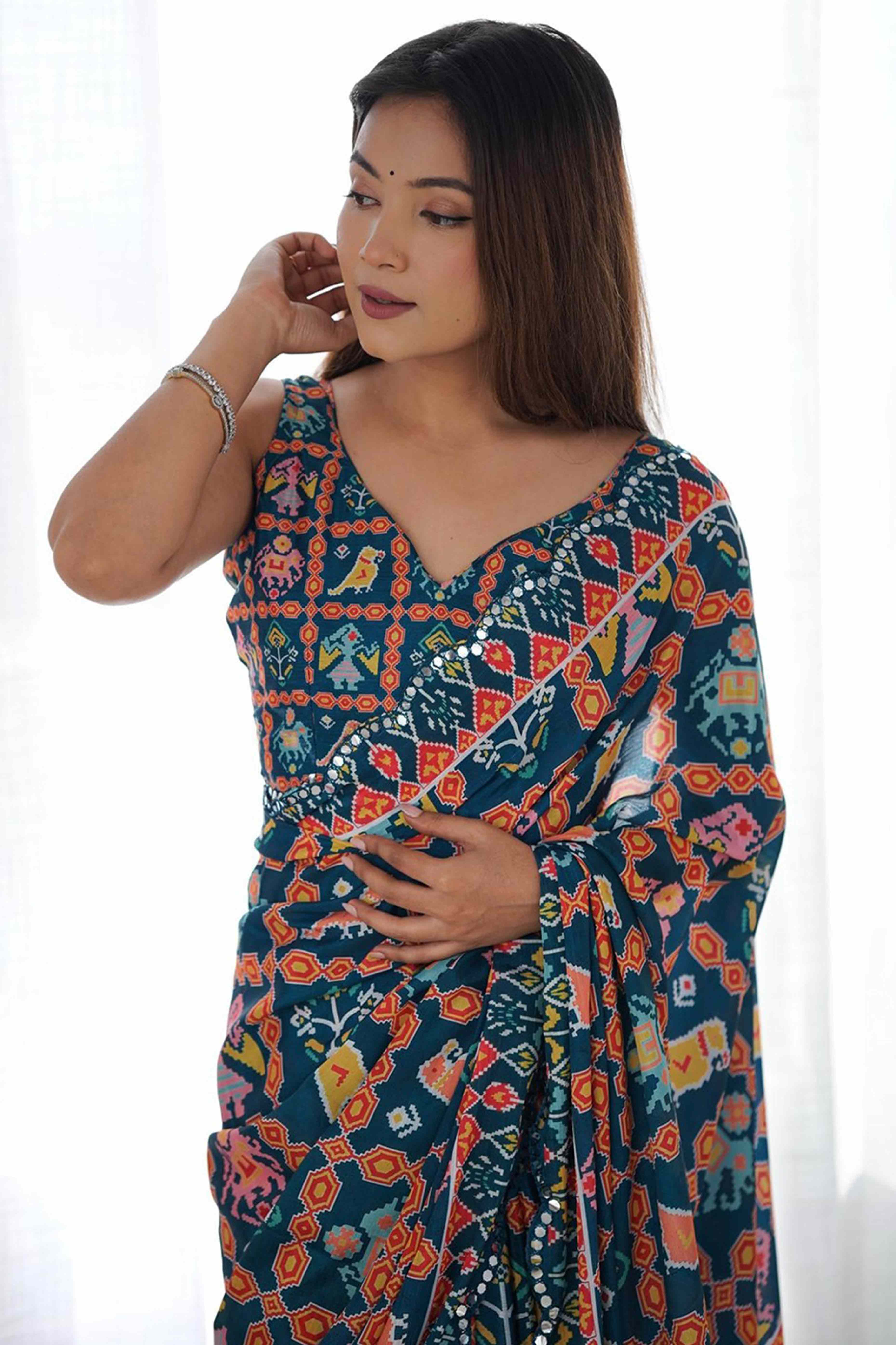 Dark Teal Blue Digital Print Georgette Saree Enhanced With A Sparkling Lace Border